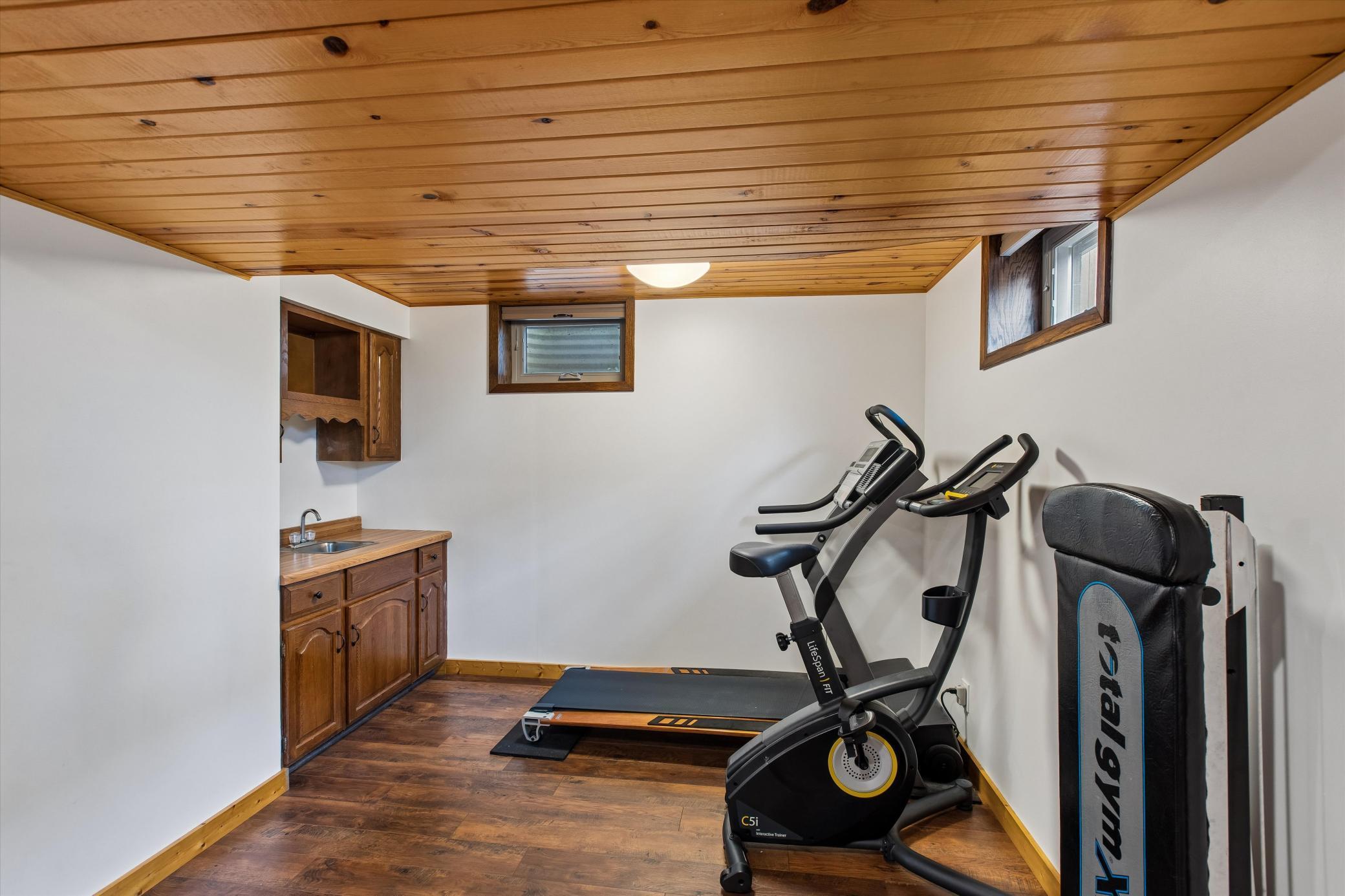Wet Bar has power in the cabinet for a future mini fridge. Filter drinking water.
