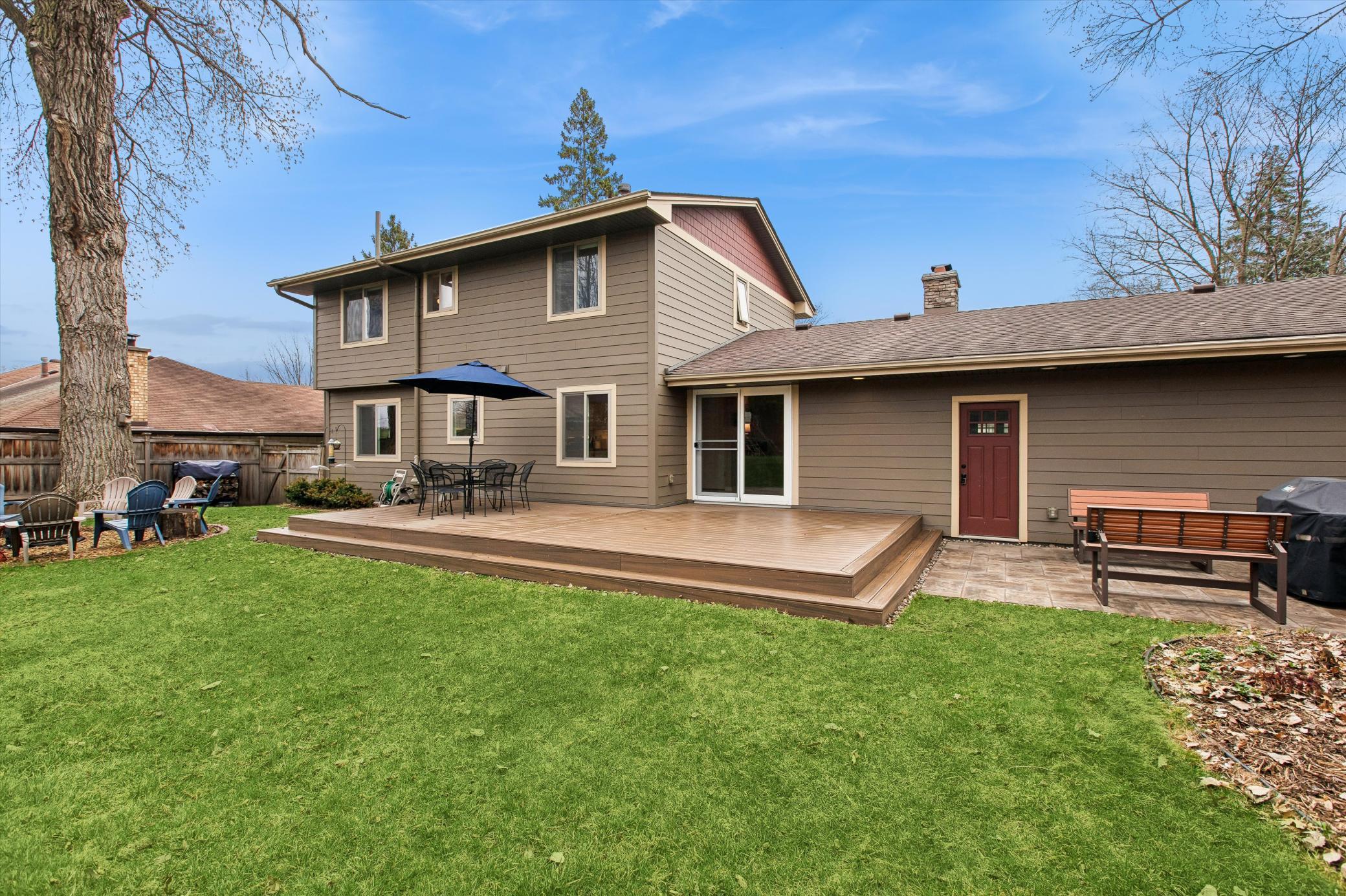 Best Backyard in the neighborhood! Trek composite deck and stone paver grilling area.