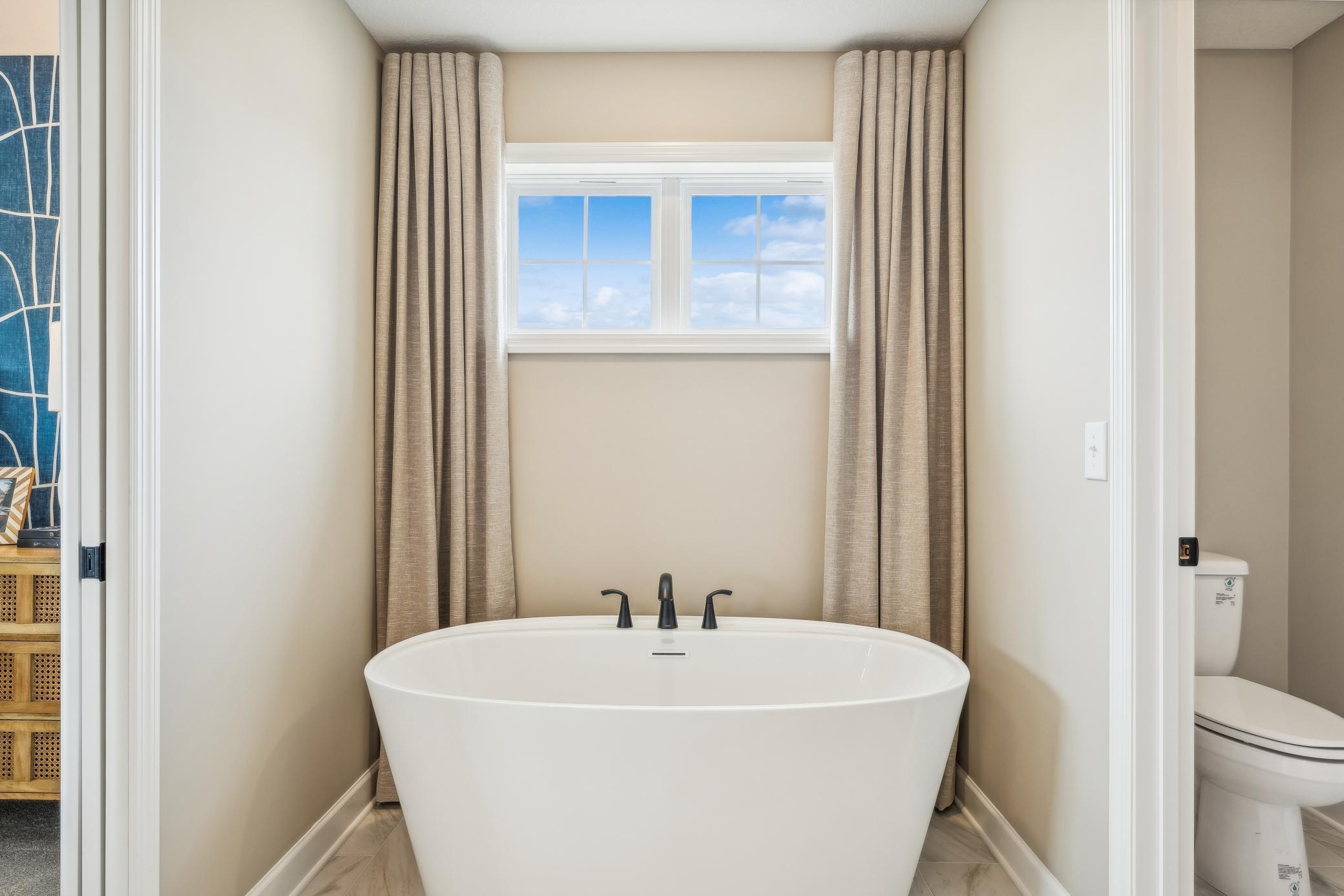 (Photo of a decorated model, actual homes finishes will vary) A view of the soaking tub.