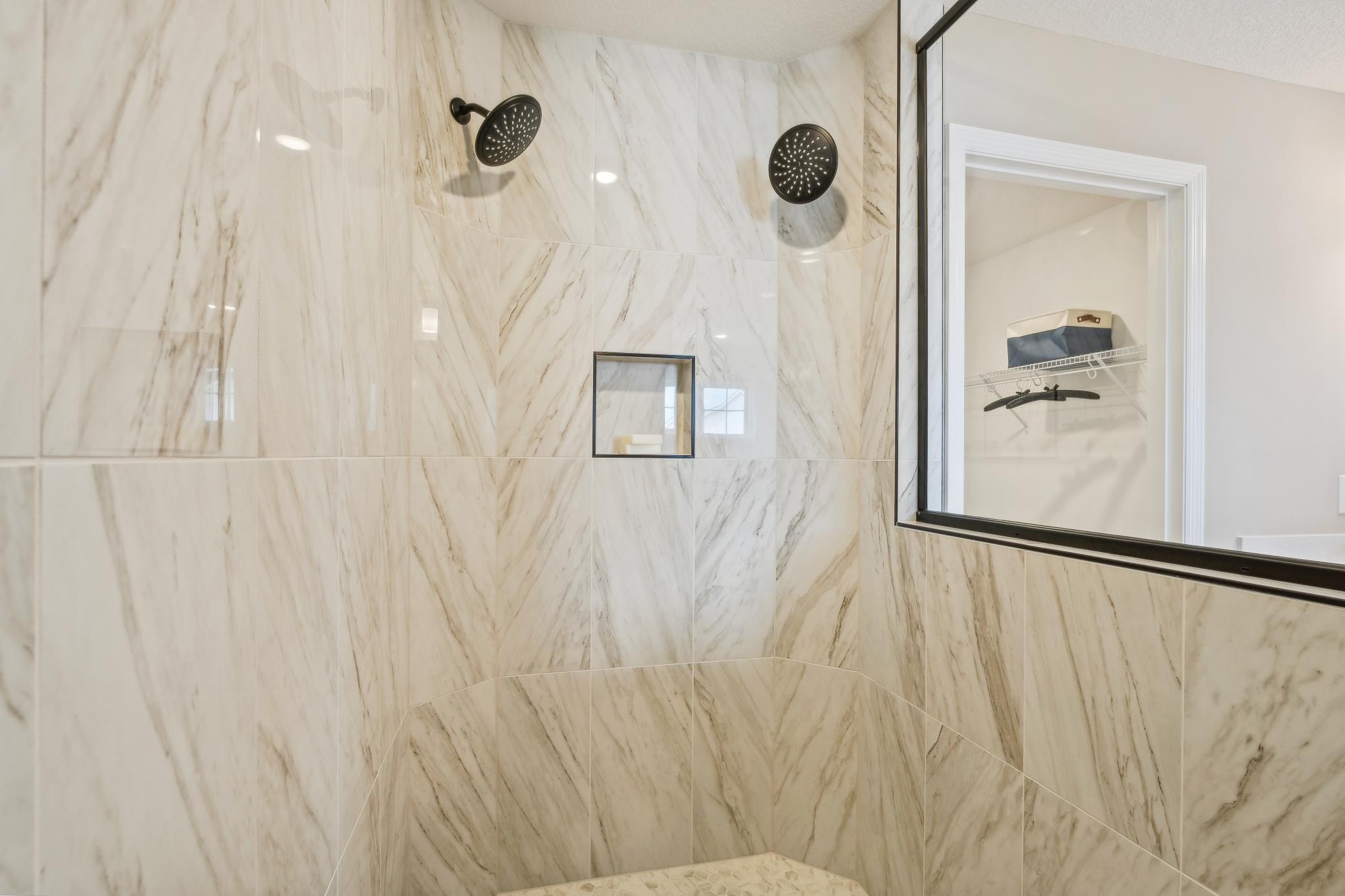 (Photo of a decorated model, actual homes finishes will vary) The serenity shower.