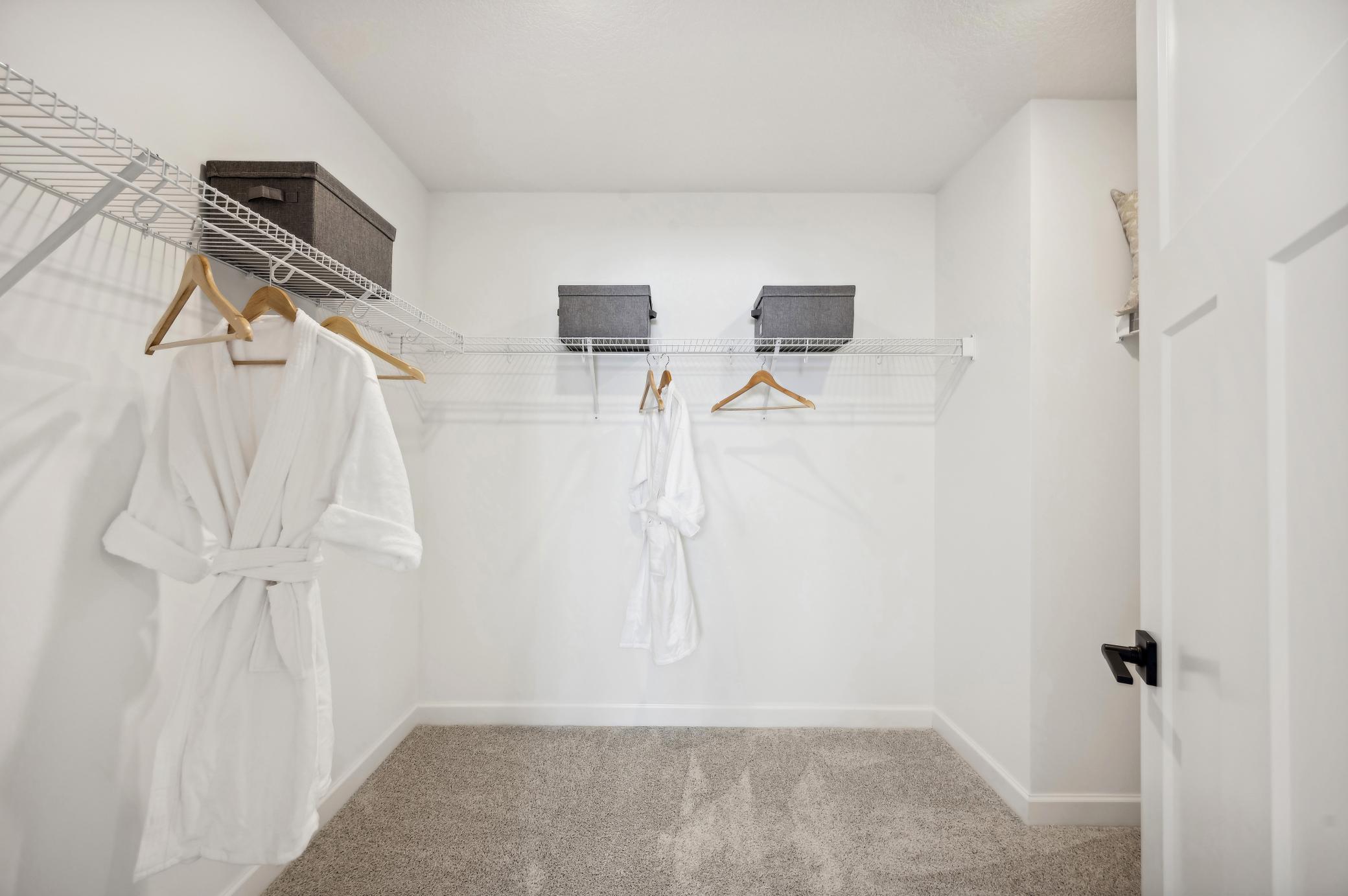 (Photo of a decorated model, actual homes finishes will vary) The primary bedroom features an incredible walk-in closet.