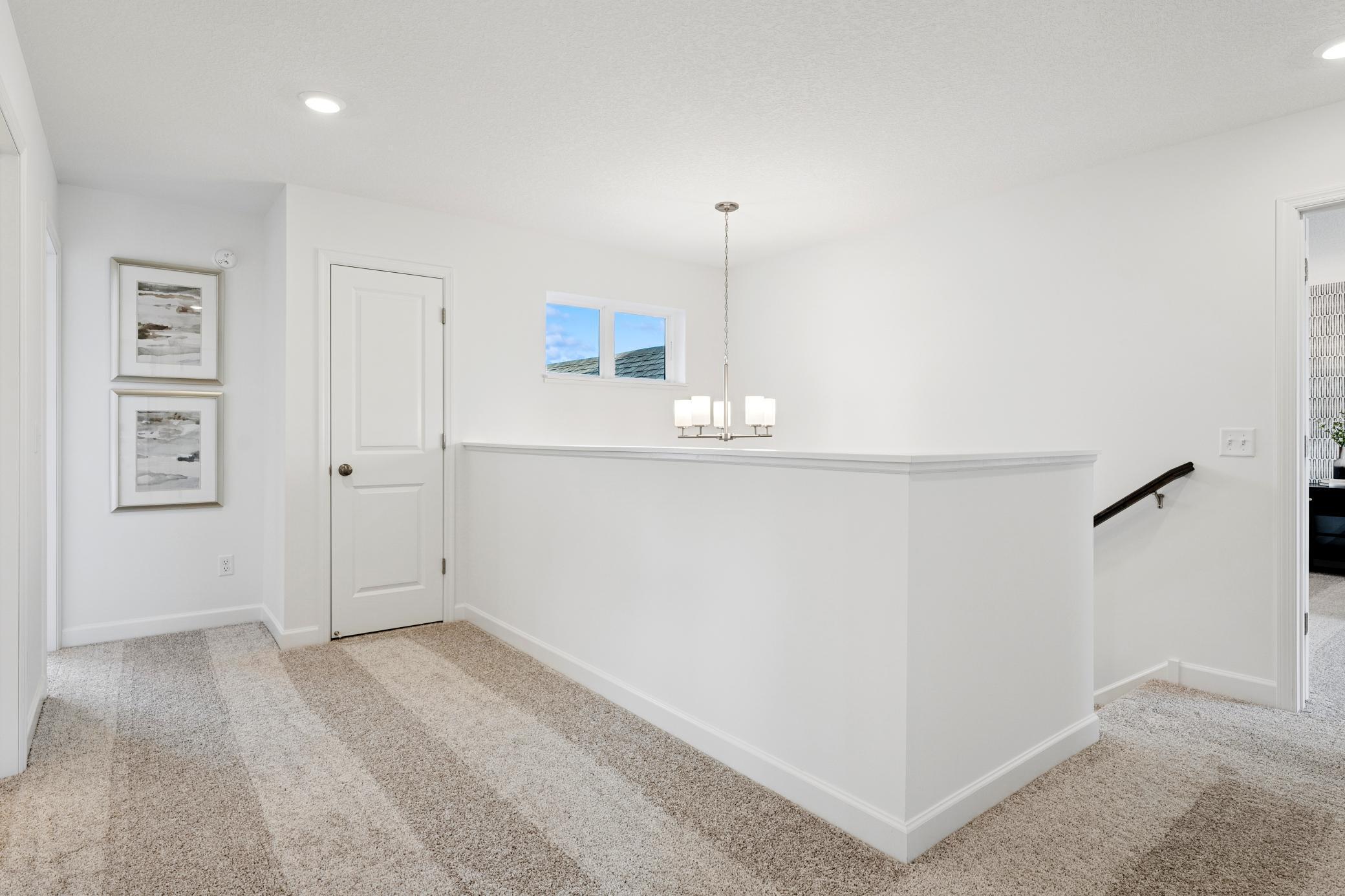 (Photos of model home, finishes will vary) Making your way up the stairs, here is a view from the landing.