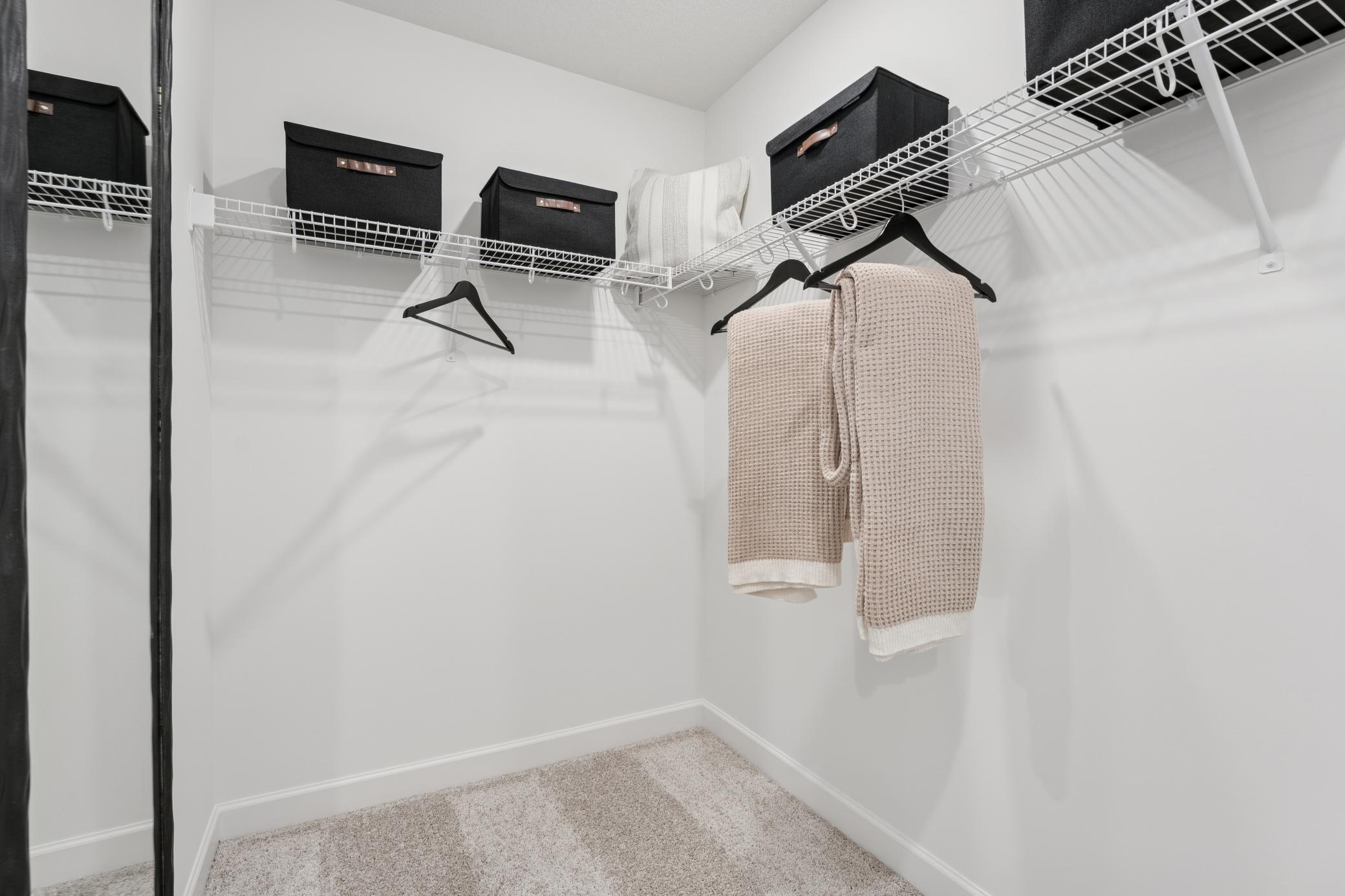 (Photos of model home, finishes will vary) Wire shelving is included in this large walk-in closet, which provides ample wardrobe space