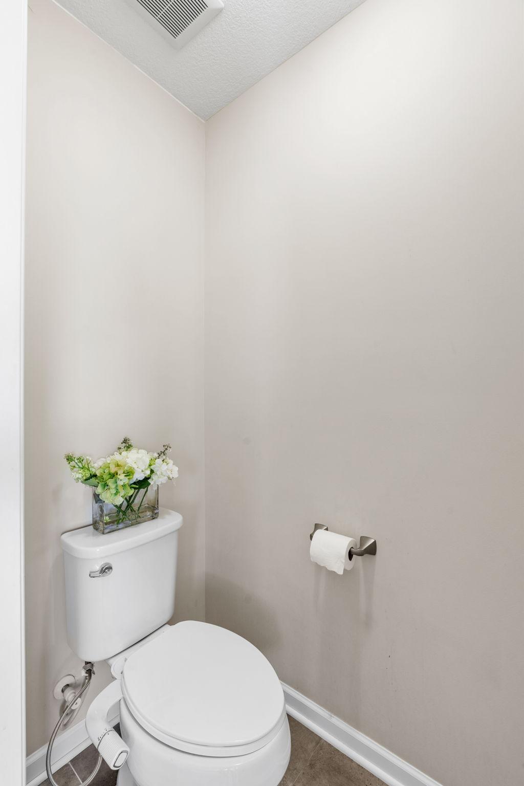 The primary bathroom includes a separate, private water closet for added comfort and convenience.