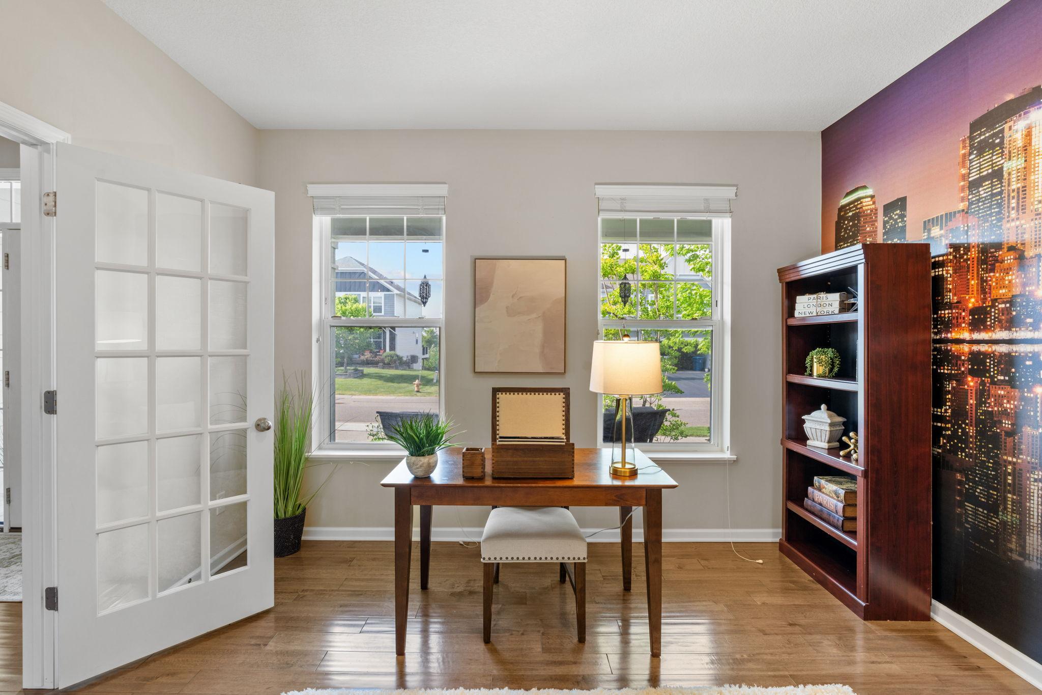 Twin windows look out to the front yard, ensuring your workday is filled with views of the quiet neighborhood greenery.