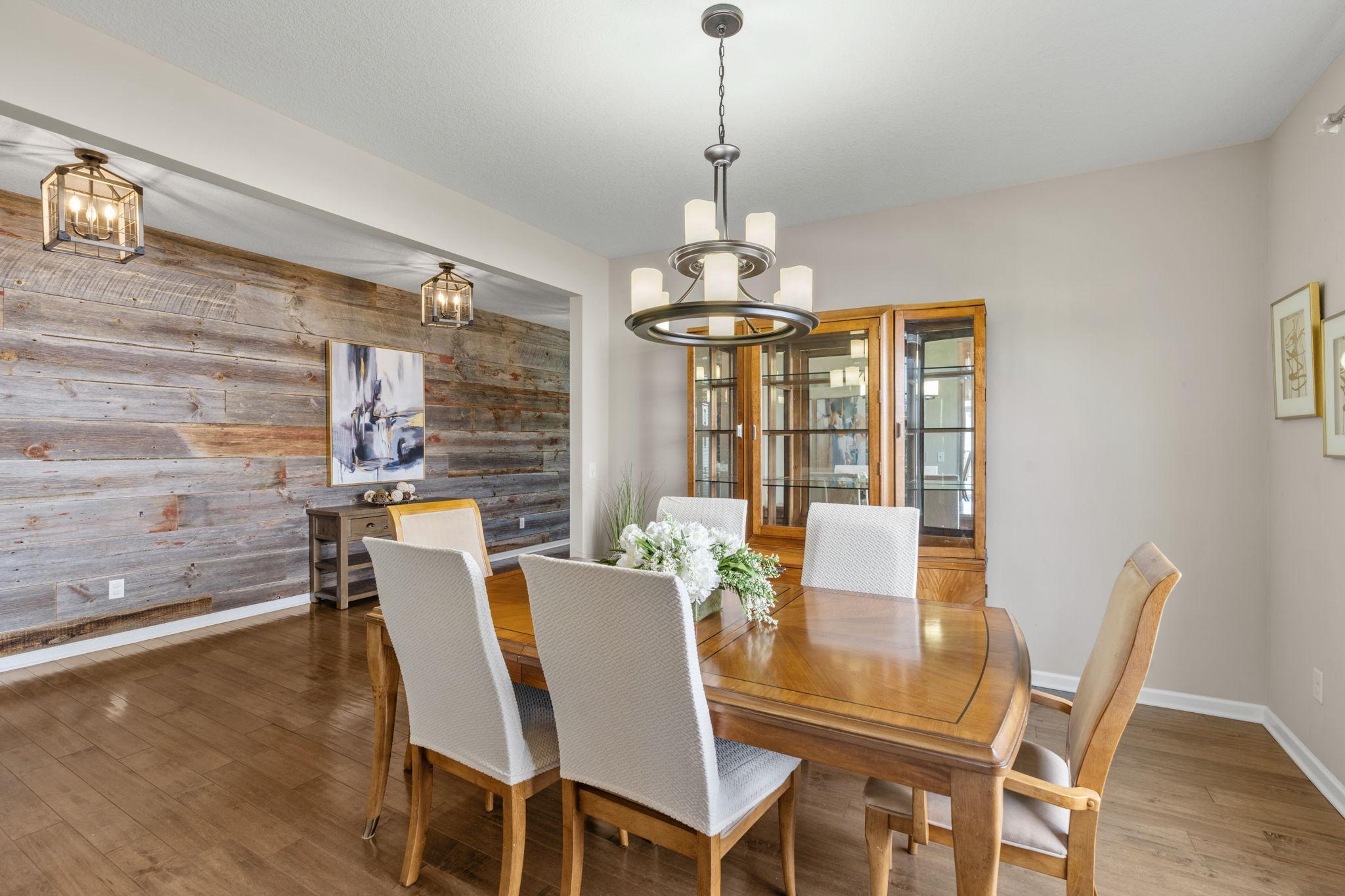Generously sized to host large dinner parties, this room easily accommodates a full-sized dining table, hutch, and additional custom storage pieces.