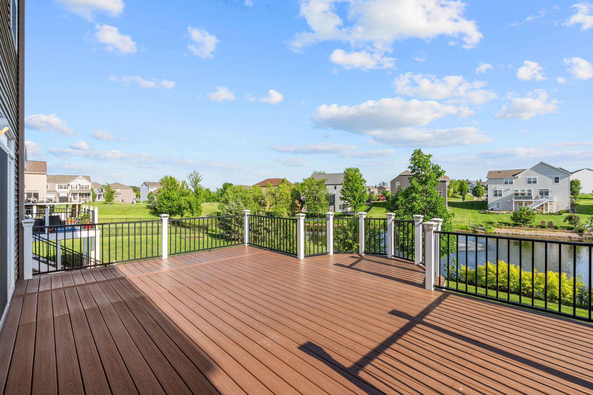 Take in the gorgeous, wide-open views of the surrounding neighborhood and water features from your elevated, sun-drenched deck.