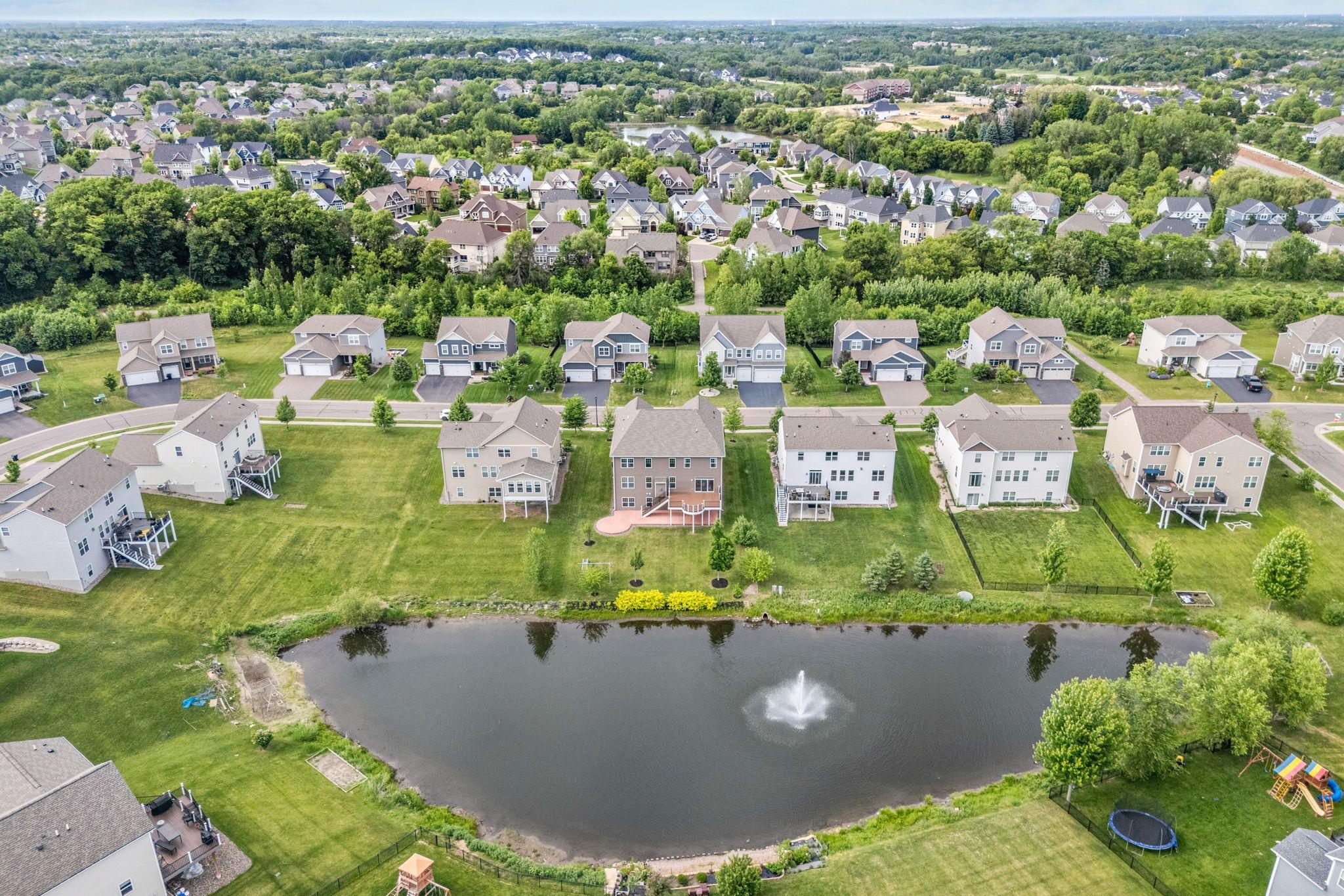 A stunning high-angle look at the pond layout, highlighting the peaceful environment surrounding the estate.
