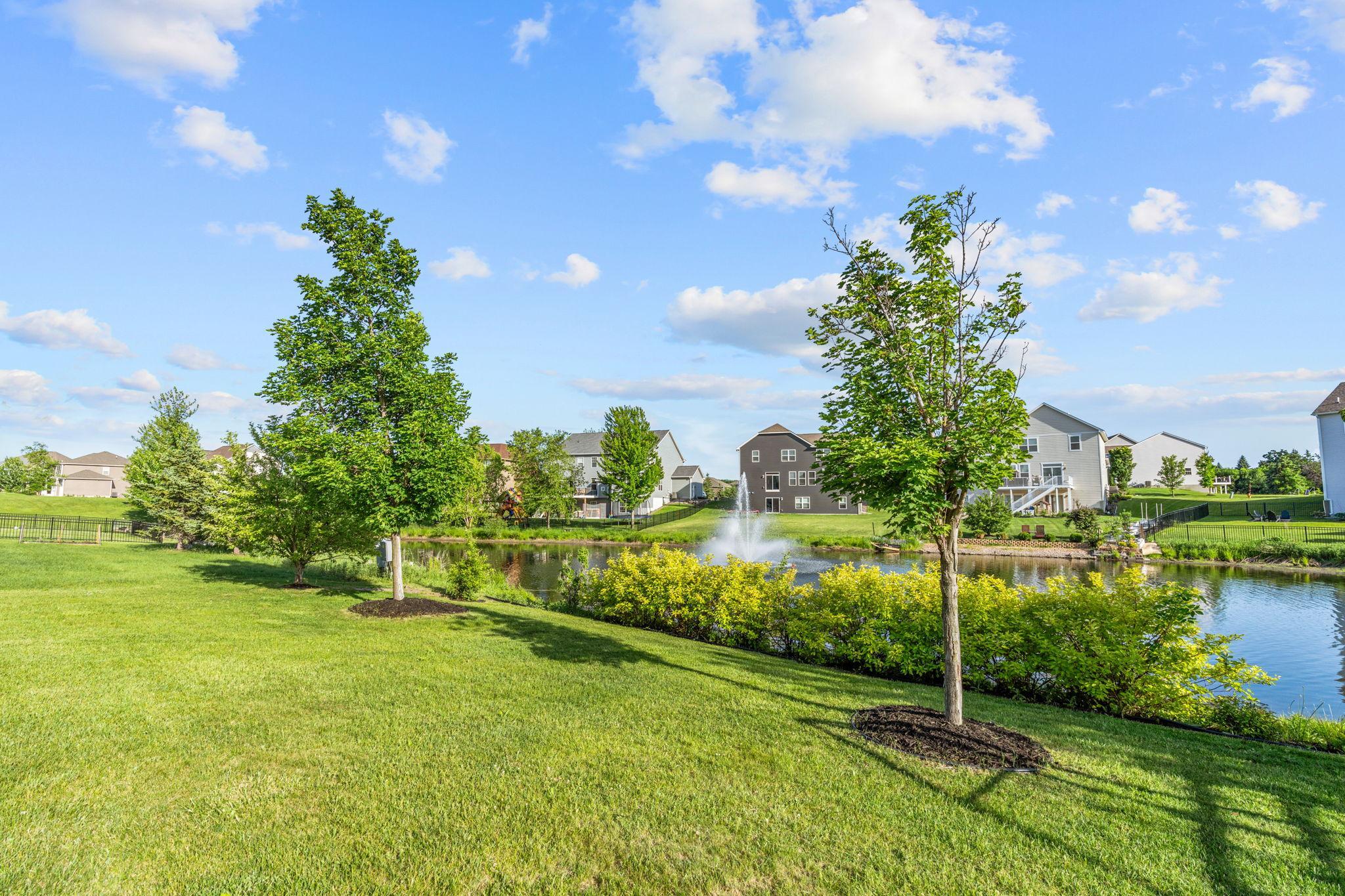 Enjoy peaceful, picturesque views of the neighborhood pond right from your property line, complete with a beautiful center fountain.