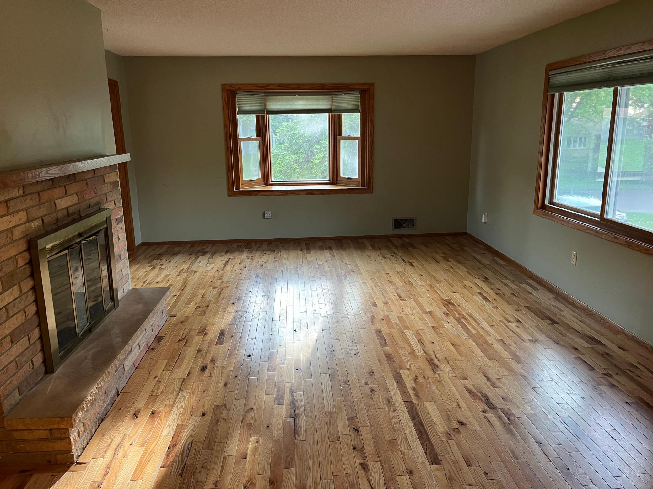 Large living room with wood burning fireplace