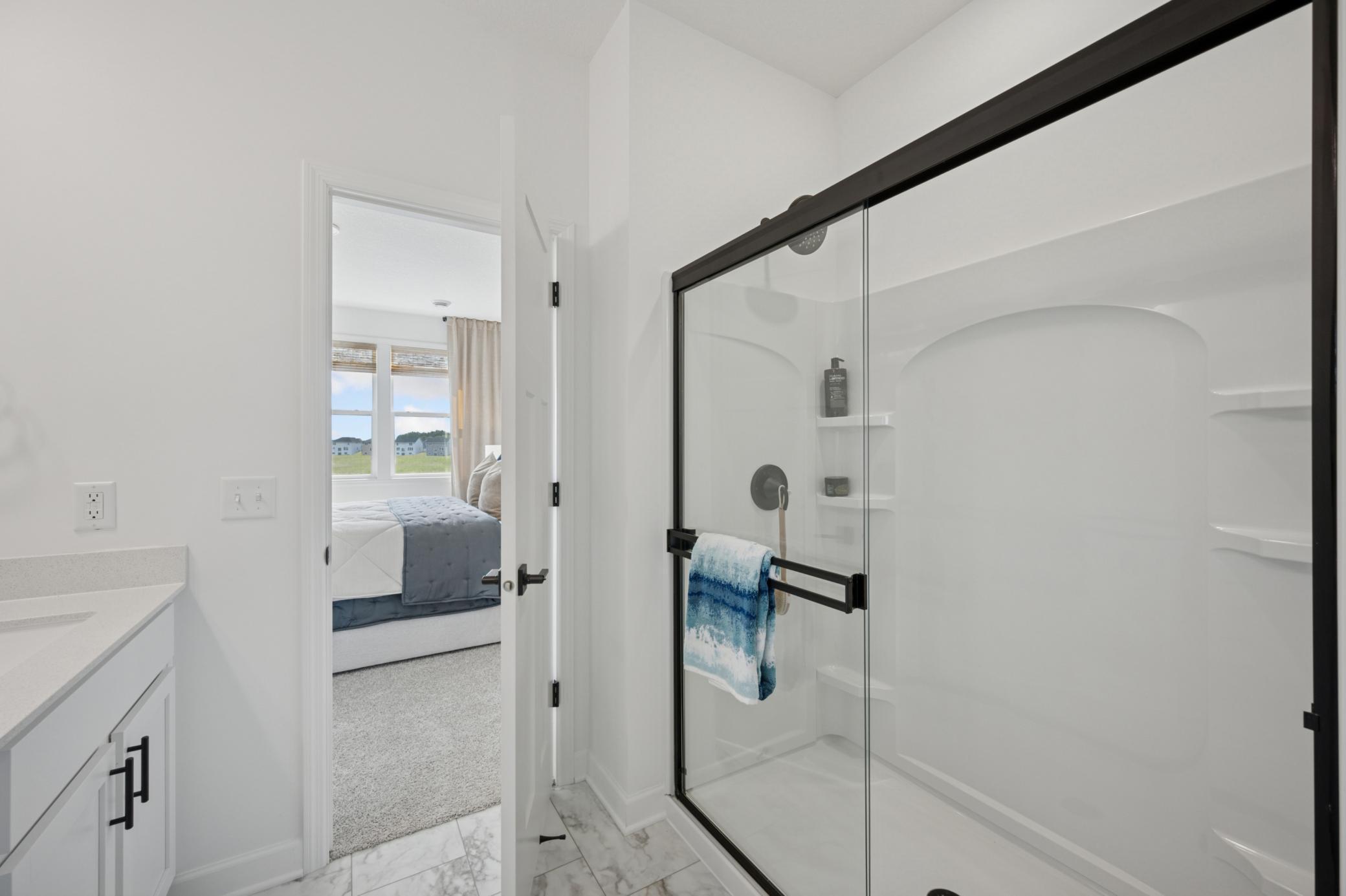 (Photo of a decorated model, actual homes finishes will vary) Another view of the primary bath.