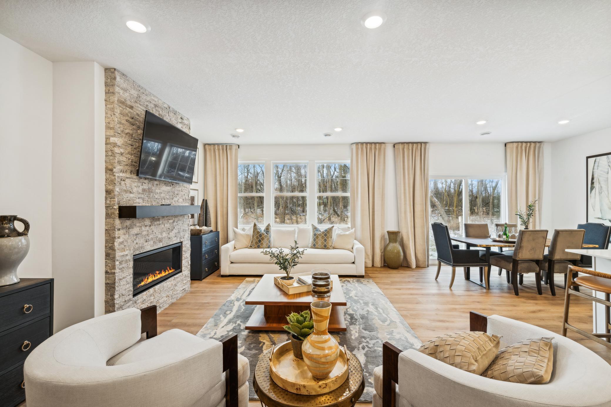 (Photo of a decorated model, actual homes finishes will vary) The spacious and open-concept main level allow for optimal versatility and comfort.