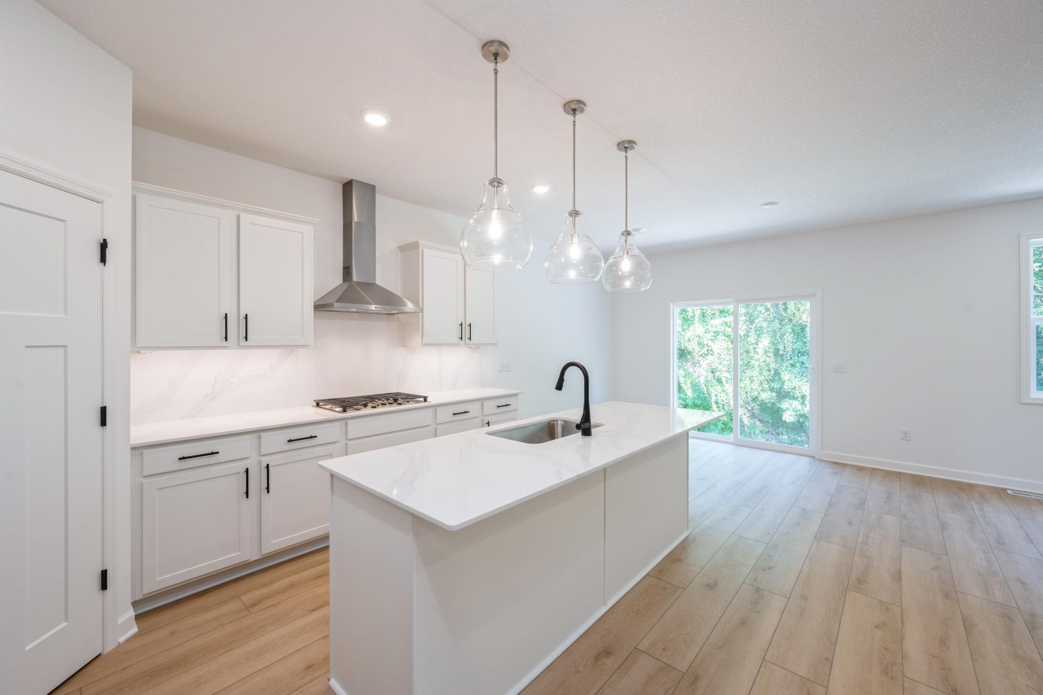 (Photo of a decorated model, actual homes finishes will vary) A corner pantry provides plenty of storage space for culinary essentials