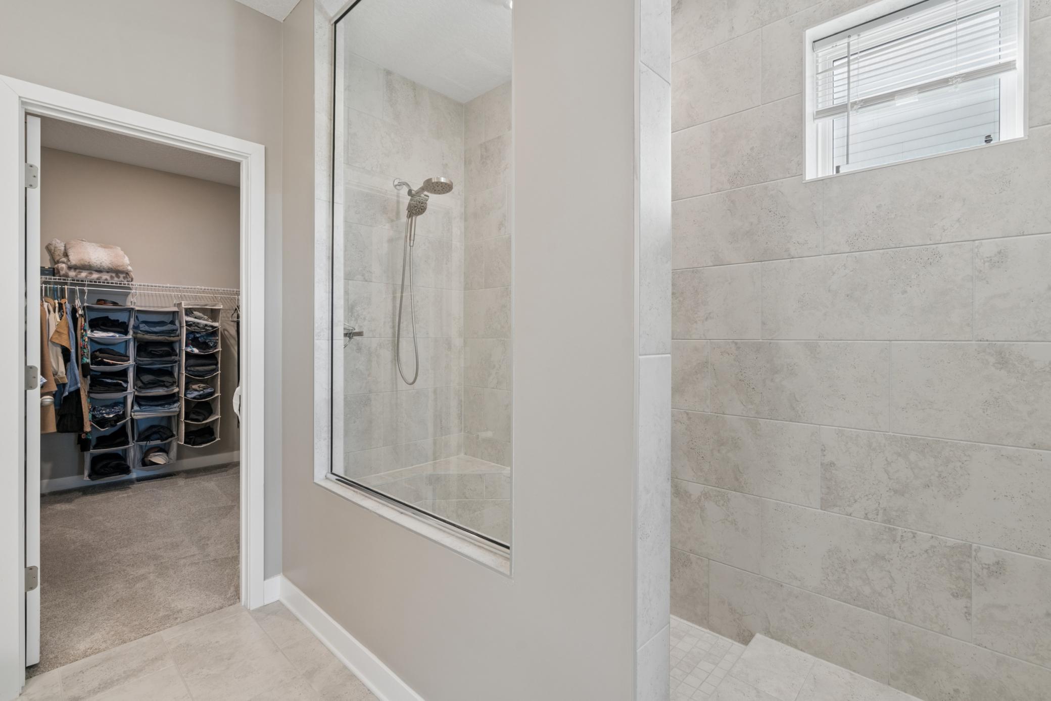 Luxury walk-in Tile Shower & Expansive Closet Space