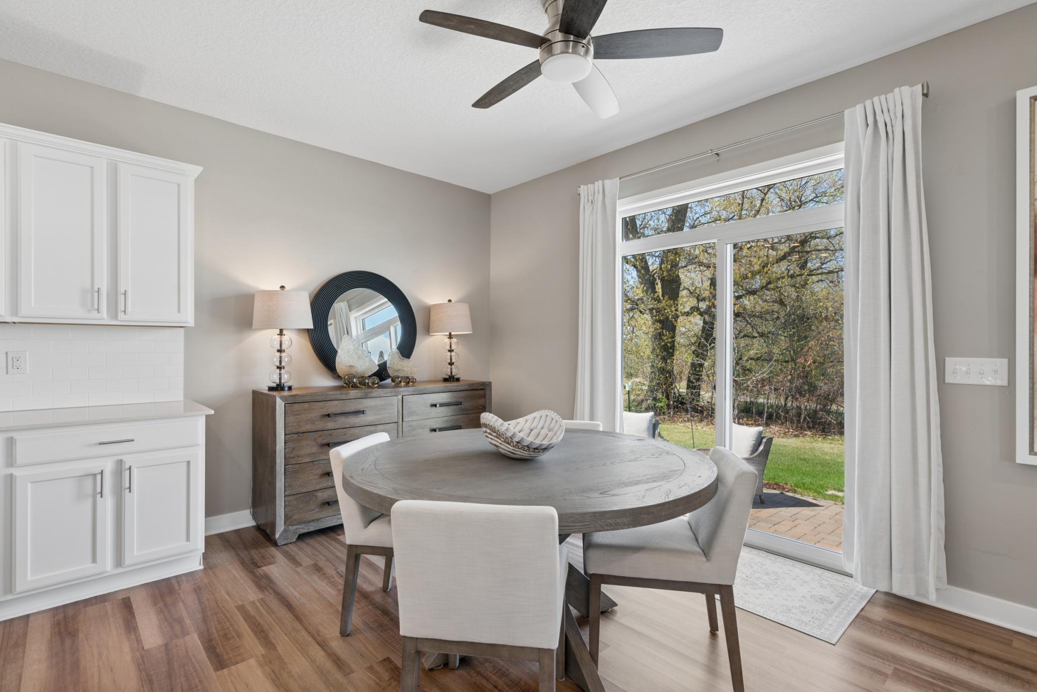 Sunny Dining Area Overlooking the Private Backyard