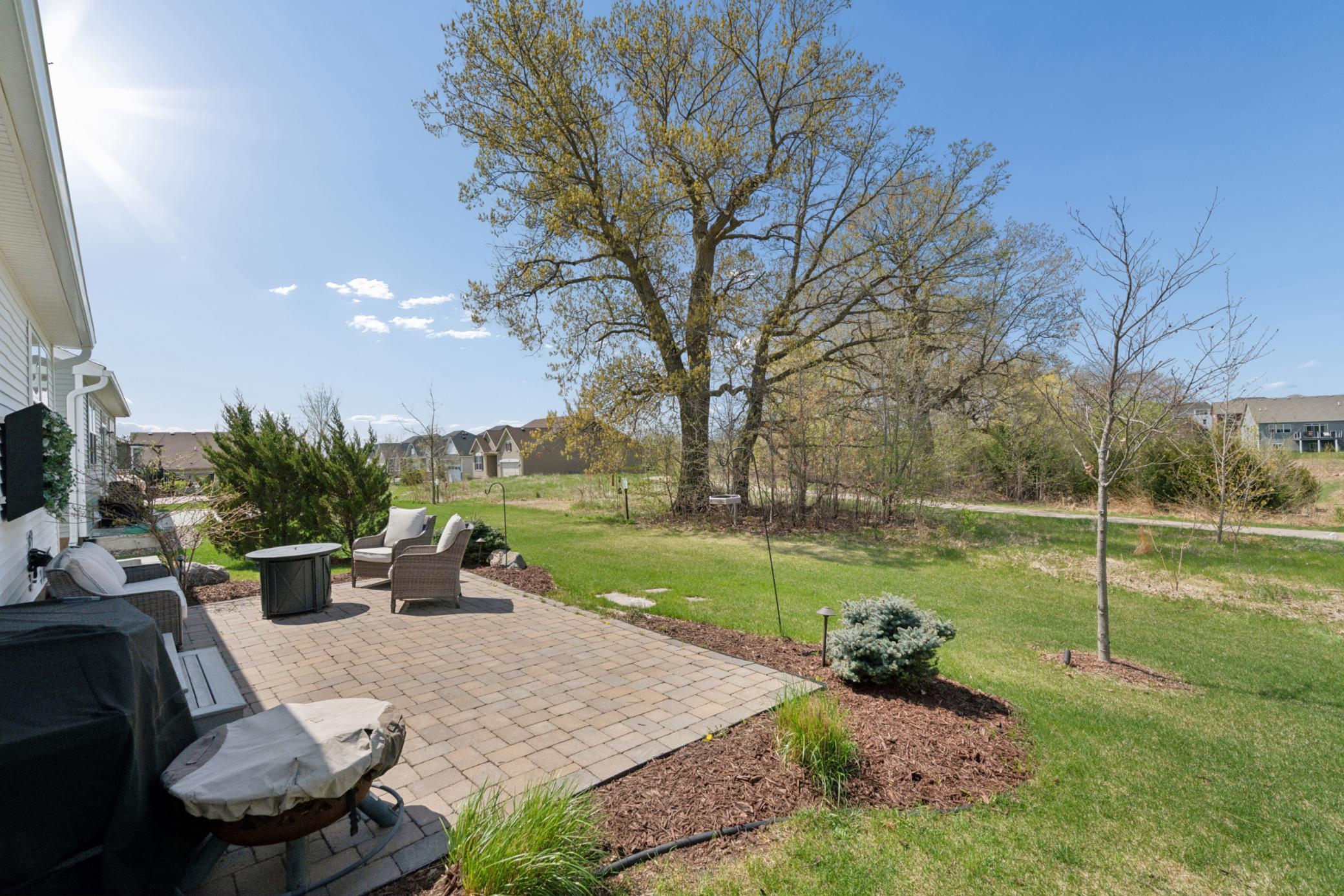 Peaceful setting overlooking mature trees and open green space — enjoy nature right from your patio.