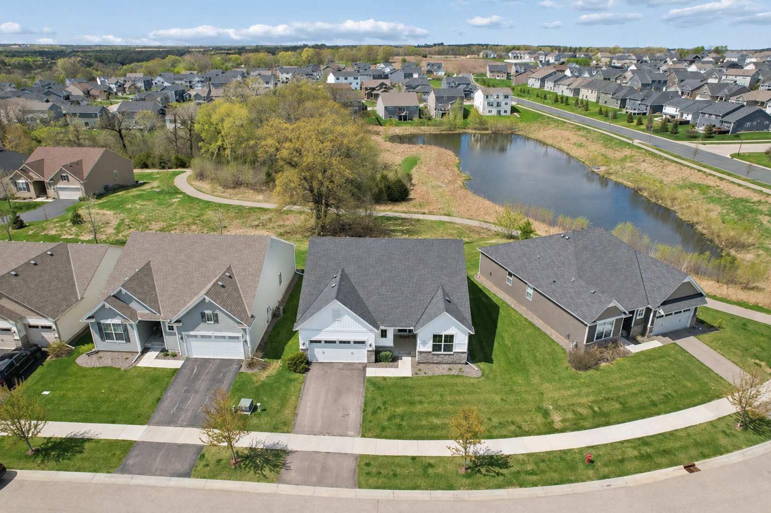 Stunning perspective showcasing the home’s prime location near a pond