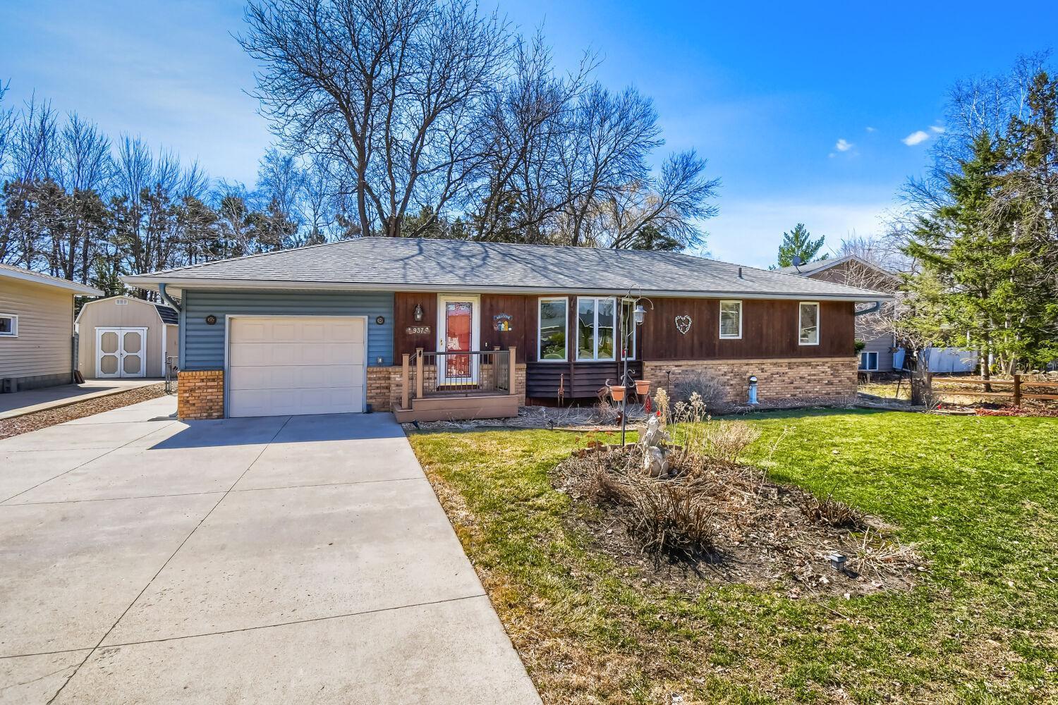 Front of the house showing driveway with parking along the side of the home