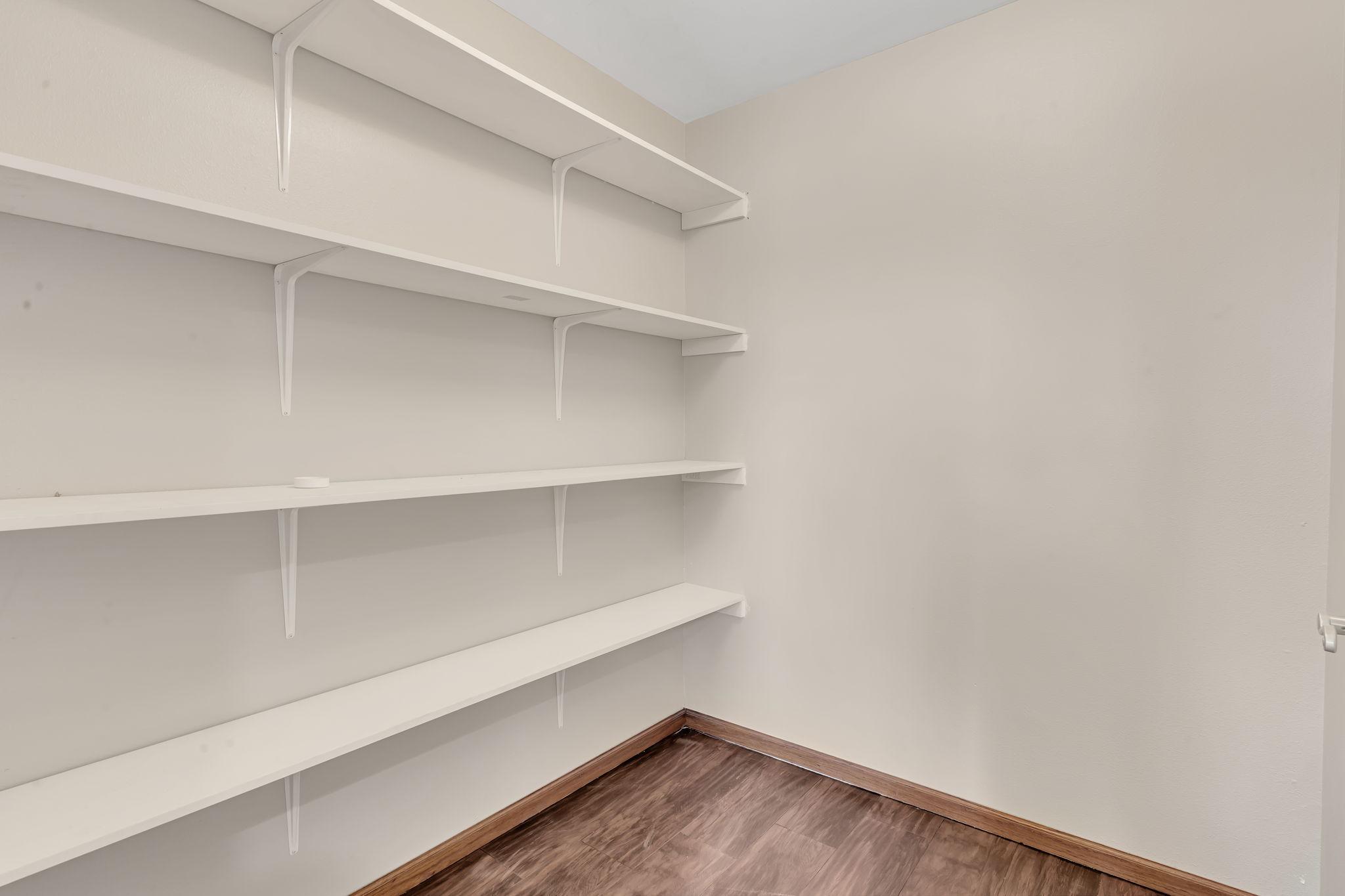 Whether you use this for storage or a pantry - this space is definately a bonus.