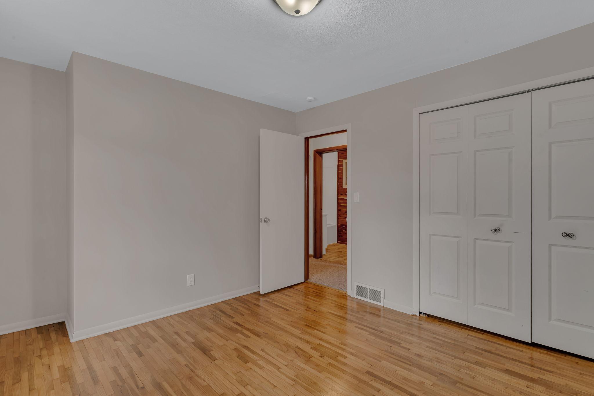 The first of 2 main floor bedrooms