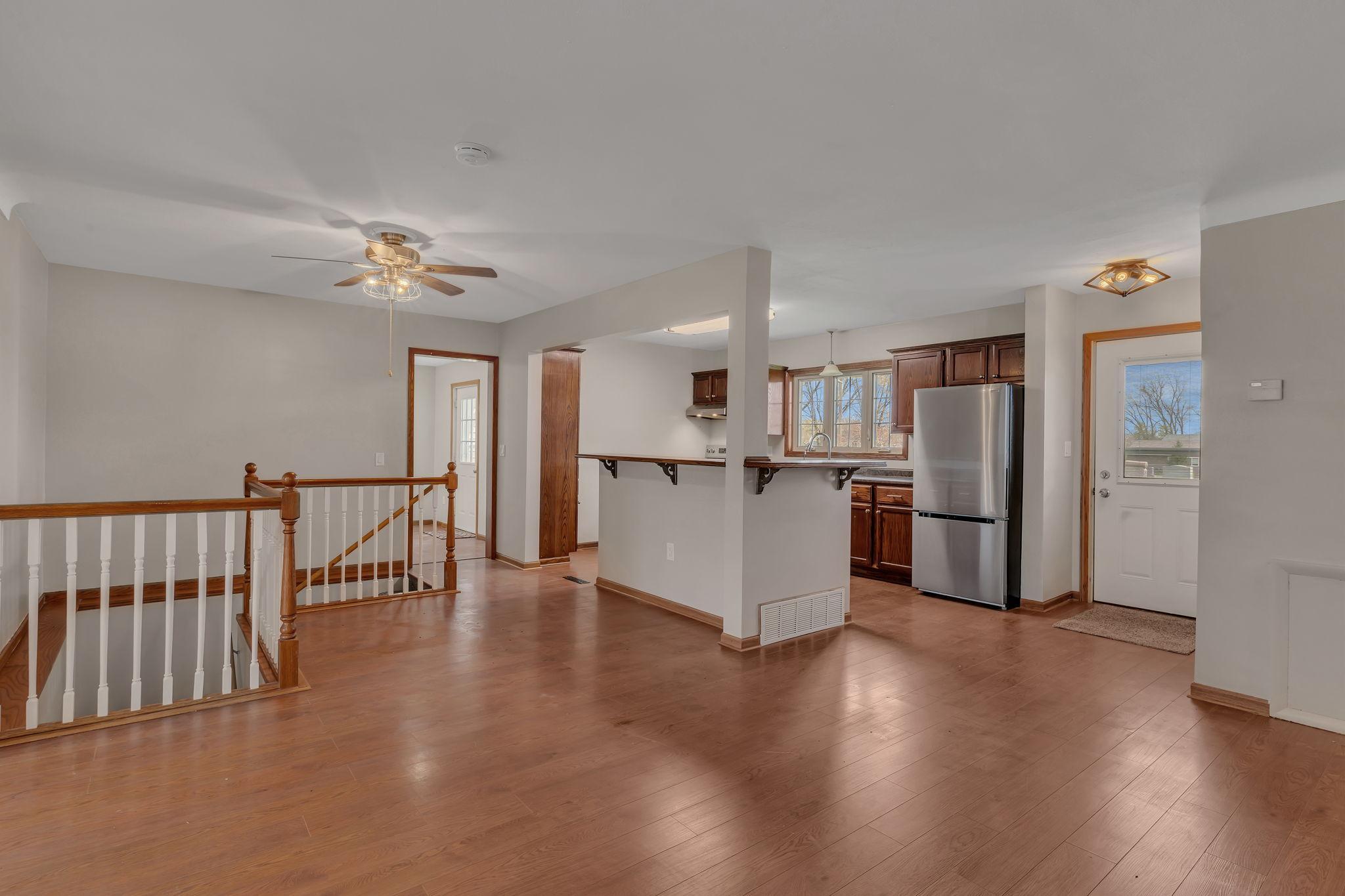 Open kitchen with plenty of counter space and new appliances. Opens to the dining space.