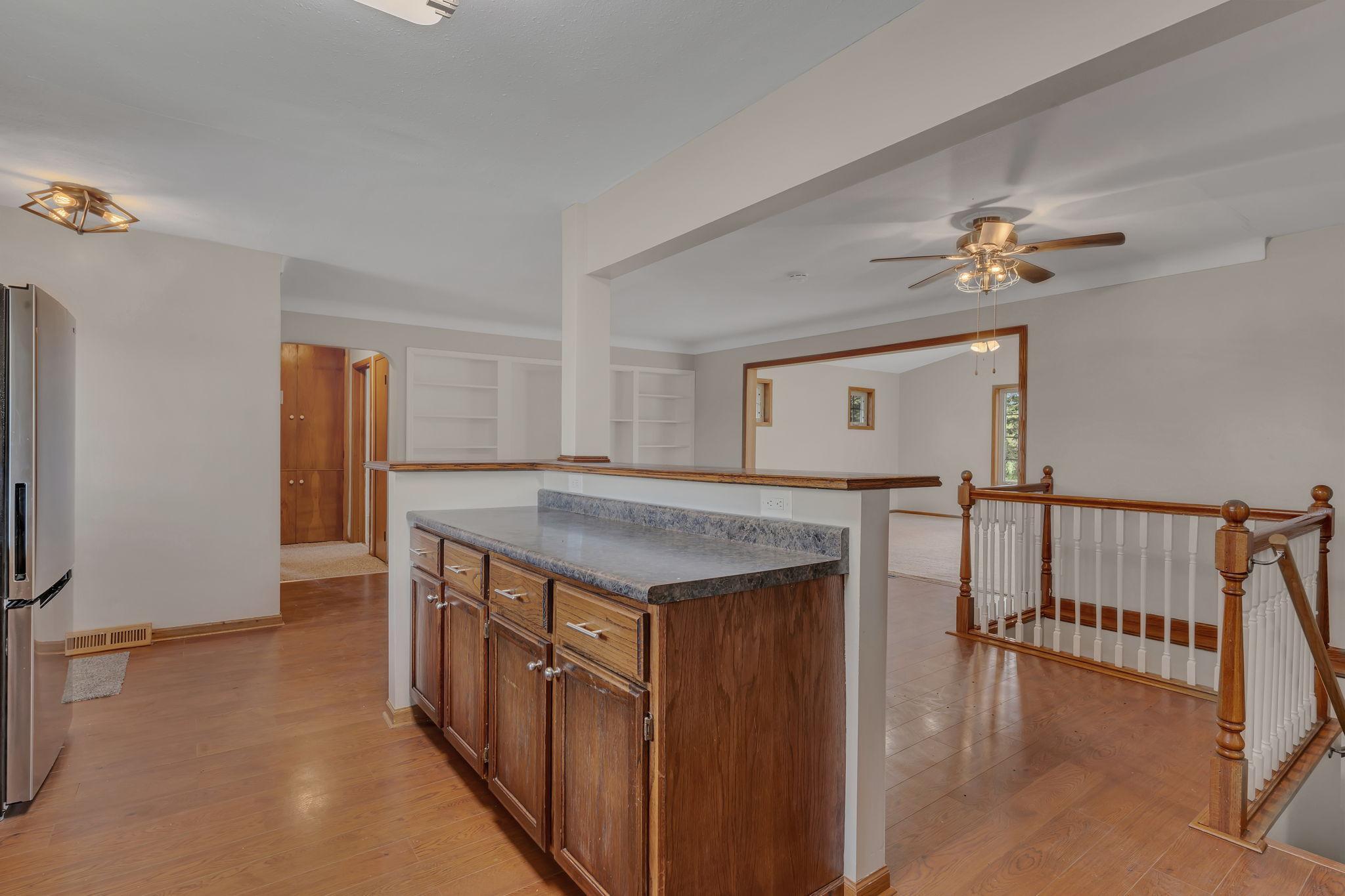 The kitchen opens to the dining space for ease of entertaining and serving.