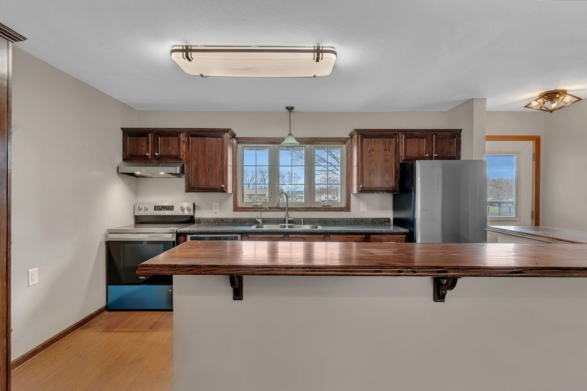 The large kitchen window over the sink lets in all that natural light.
