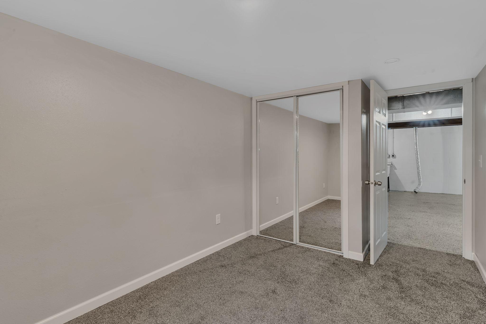 The 4th of 4 bedrooms in this house is located in the basement. Brand new carpet