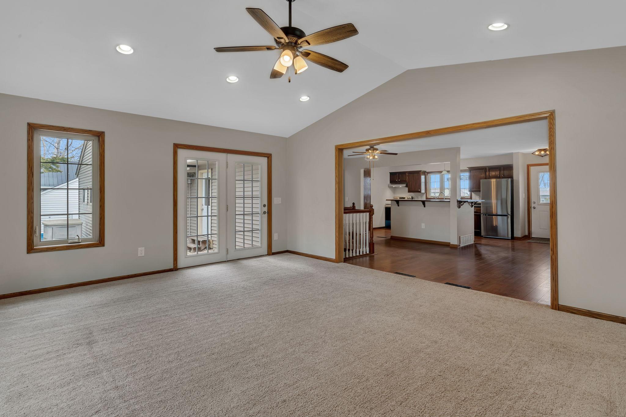 The french doors lead out to a small patio