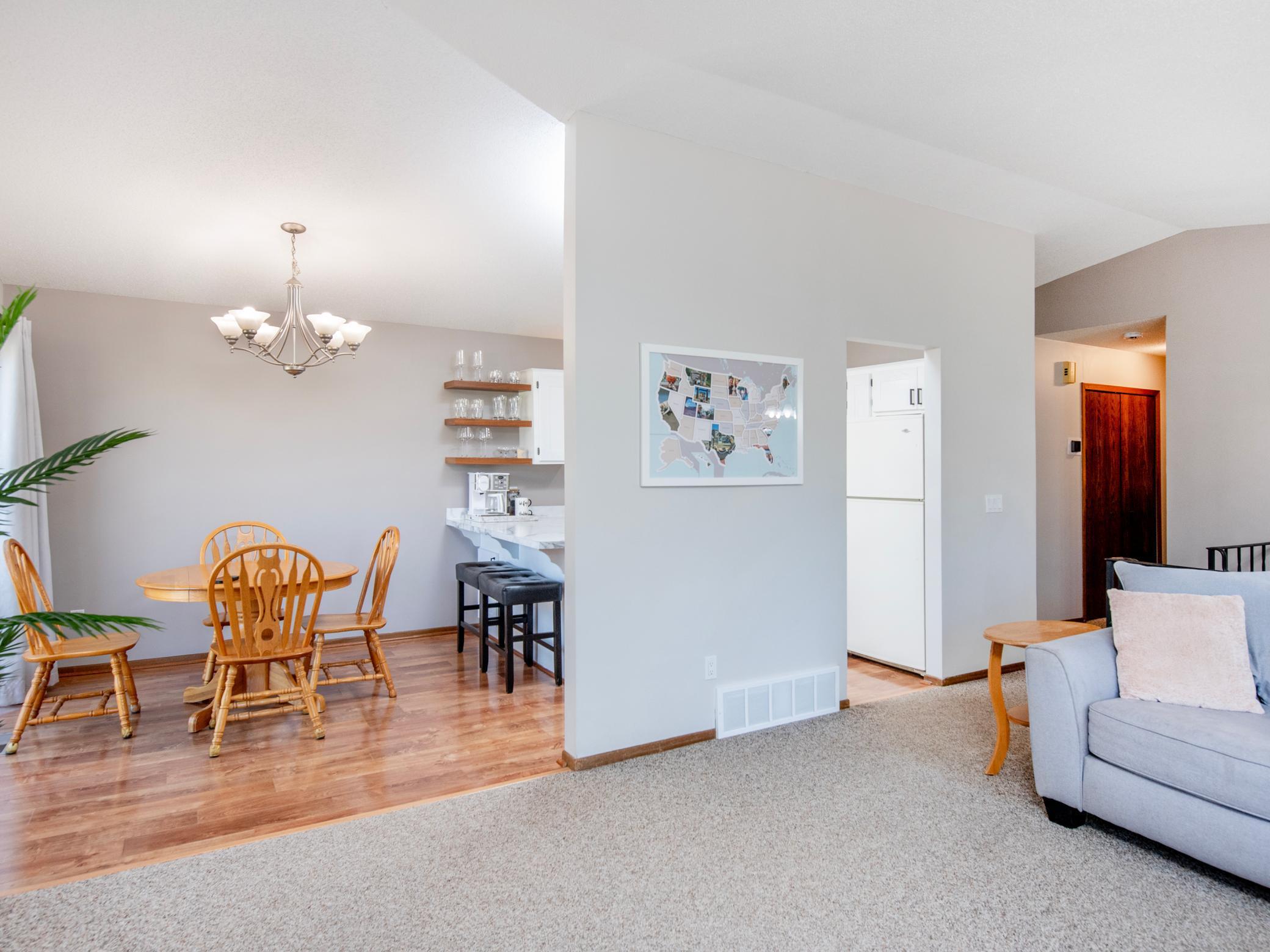 The Living Room leads to the Kitchen and Dining Room
