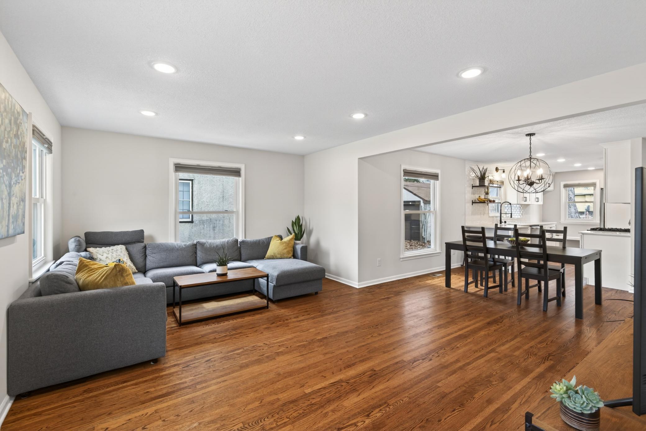 Beautiful original refinished hardwood flooring anchor the bright and open main level.