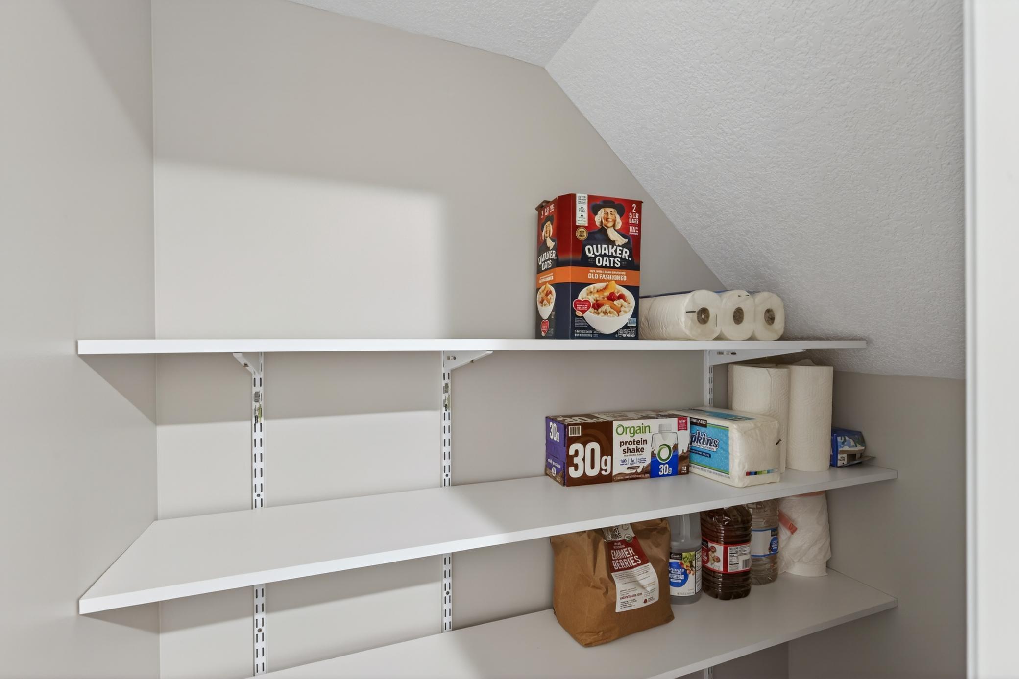 Additional storage space under the stairs.