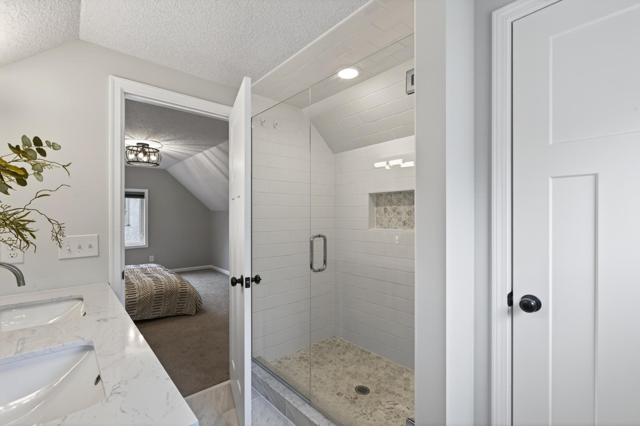 Step-in custom tiled shower.