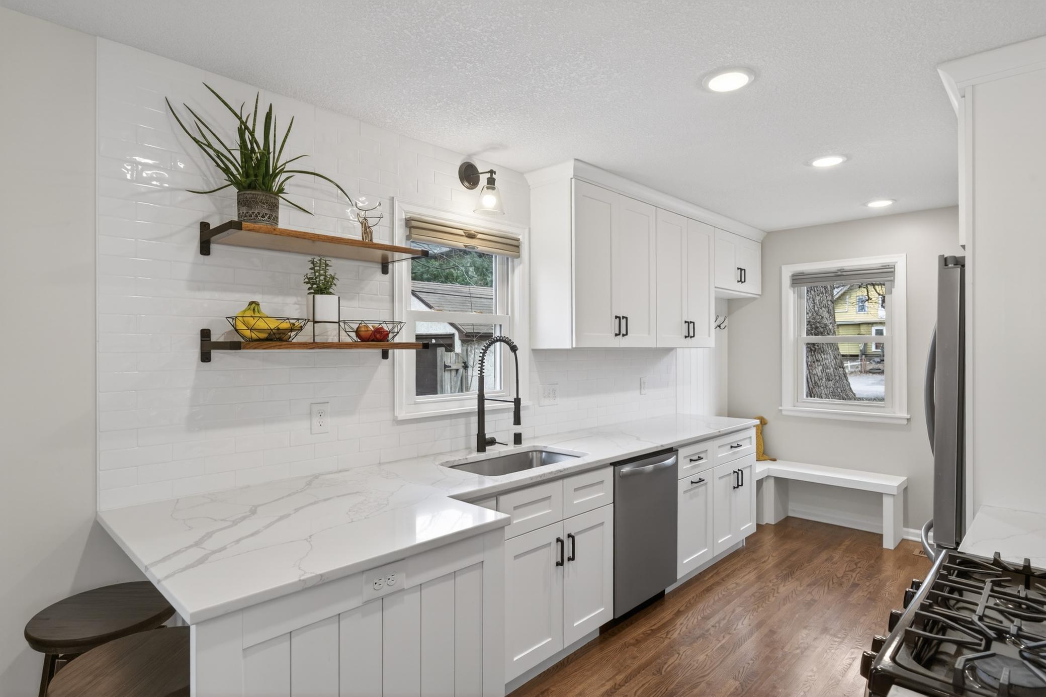 Open shelving, quartz countertops, undermount sink, soft-close drawers. The list goes on and on!