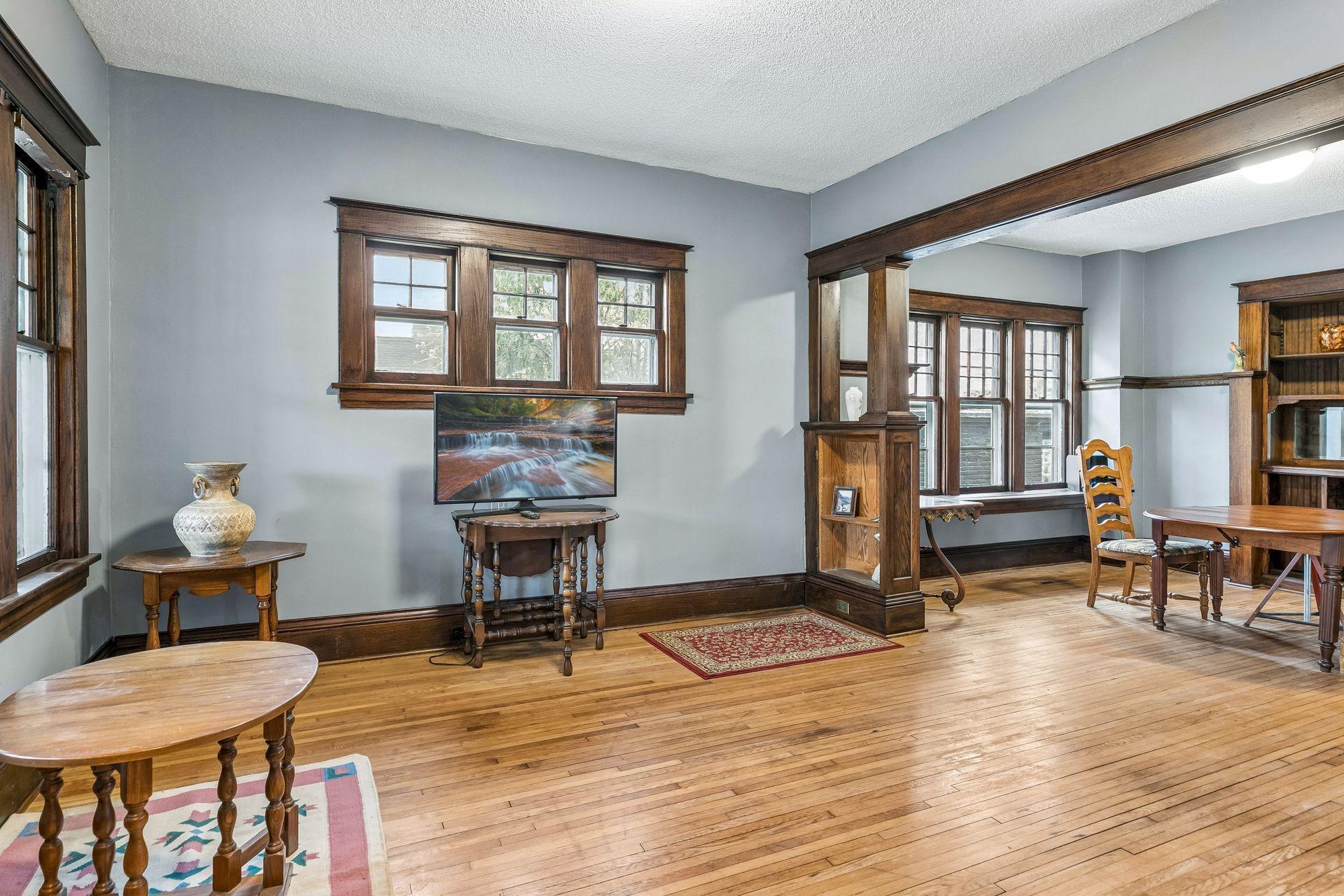 The main floor living room showcases beautiful original woodwork that adds warmth and timeless character.