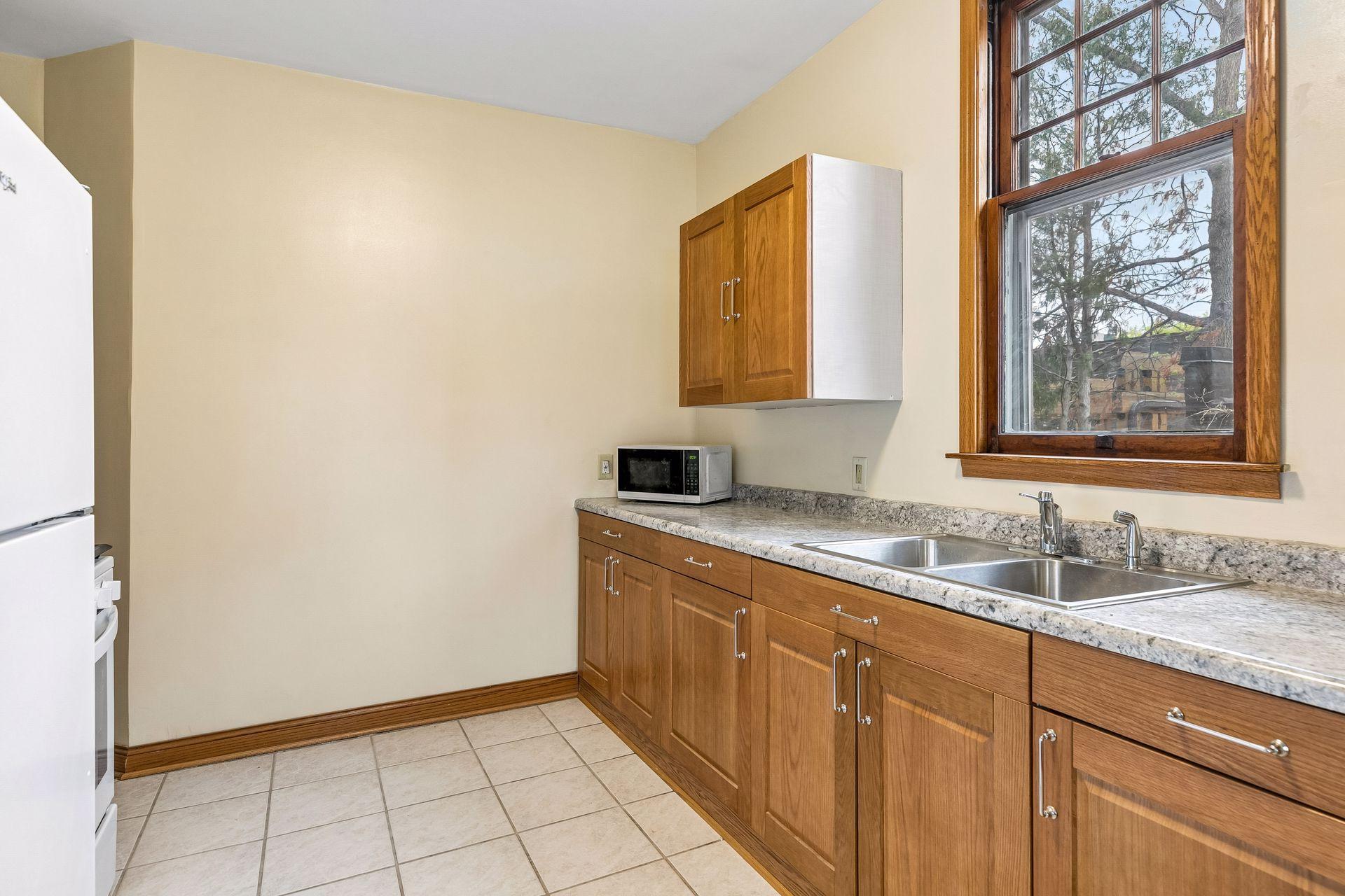 The kitchen offers a spacious layout with ample room for cooking and storage.