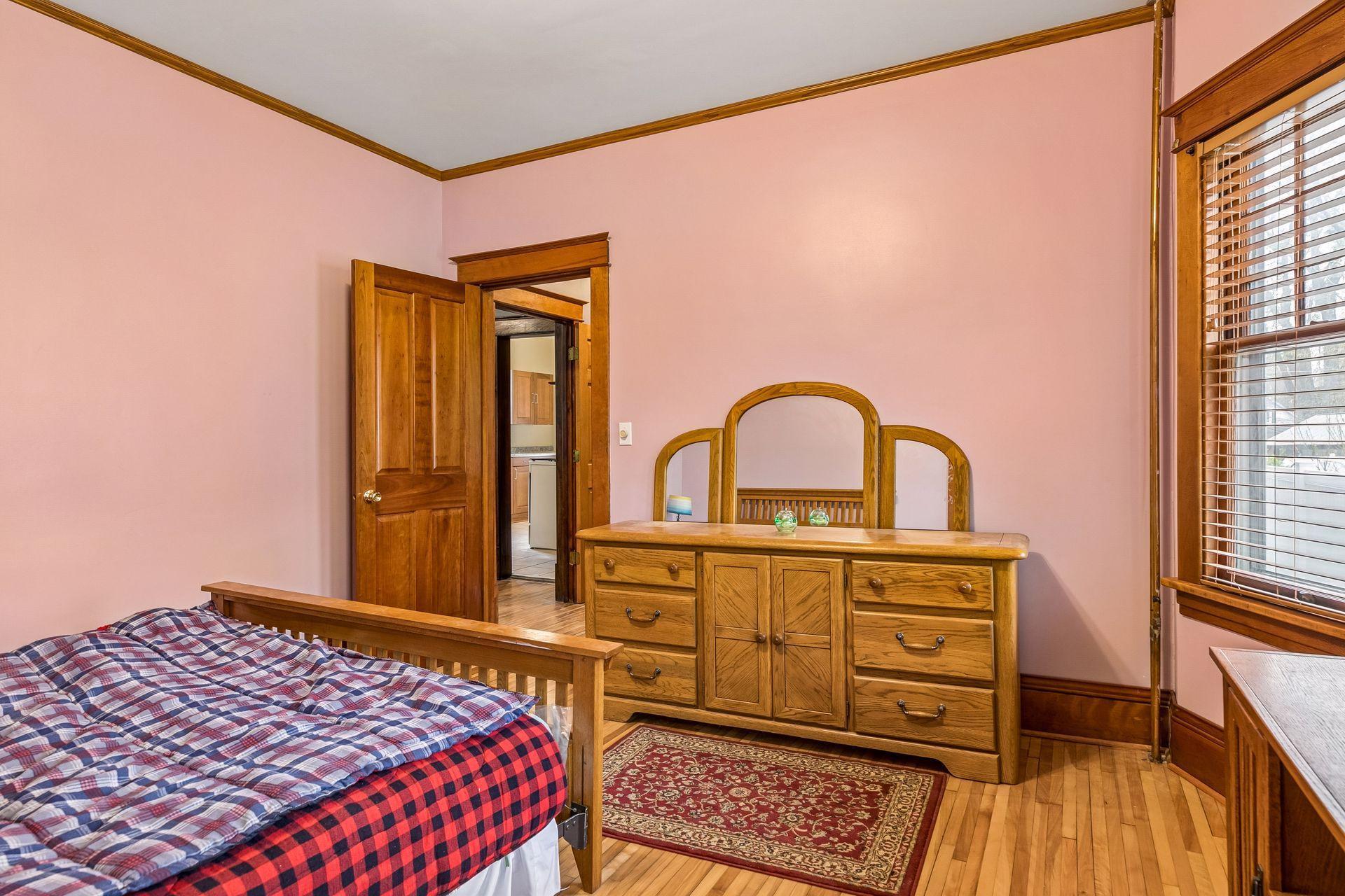 This bedroom offers a bright and comfortable retreat.