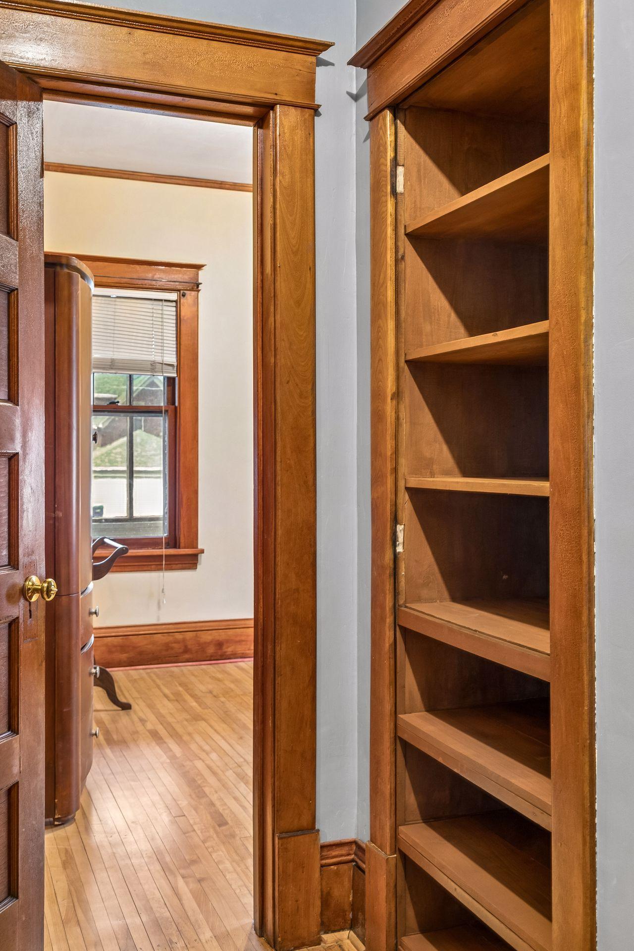 Even the hallway includes charming built-in features that enhance the home’s character.