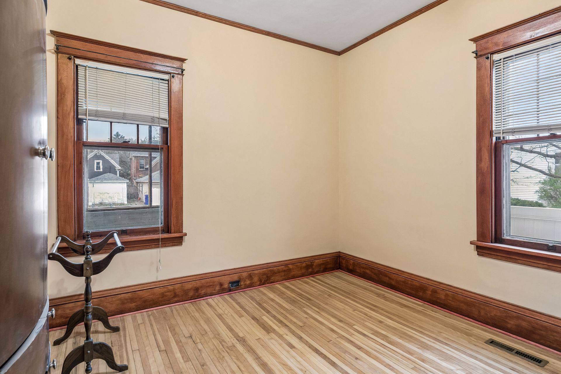 The second main floor bedroom provides flexibility for guests, a home office, or additional living space.