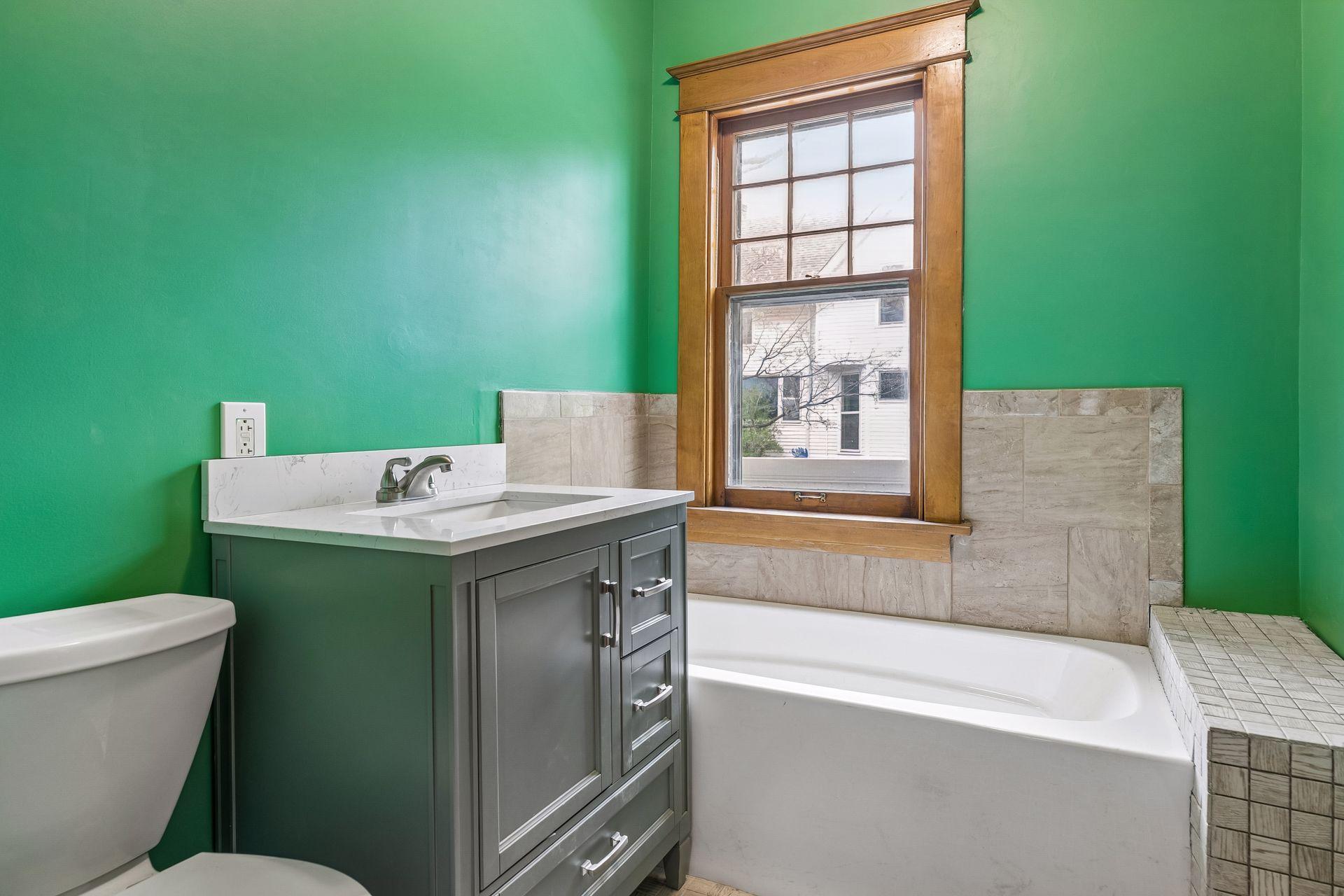 The main floor bathroom is clean, functional, and well-maintained.