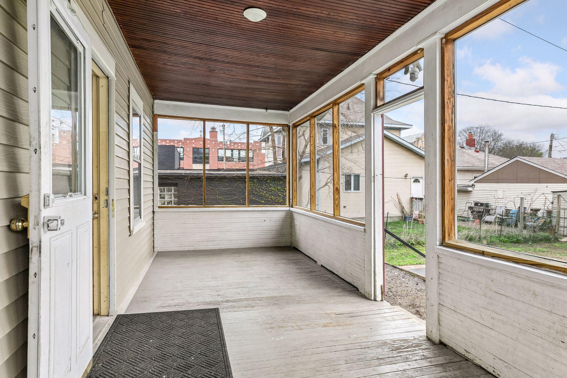 The screened-in back porch creates a perfect space for enjoying the outdoors in comfort.