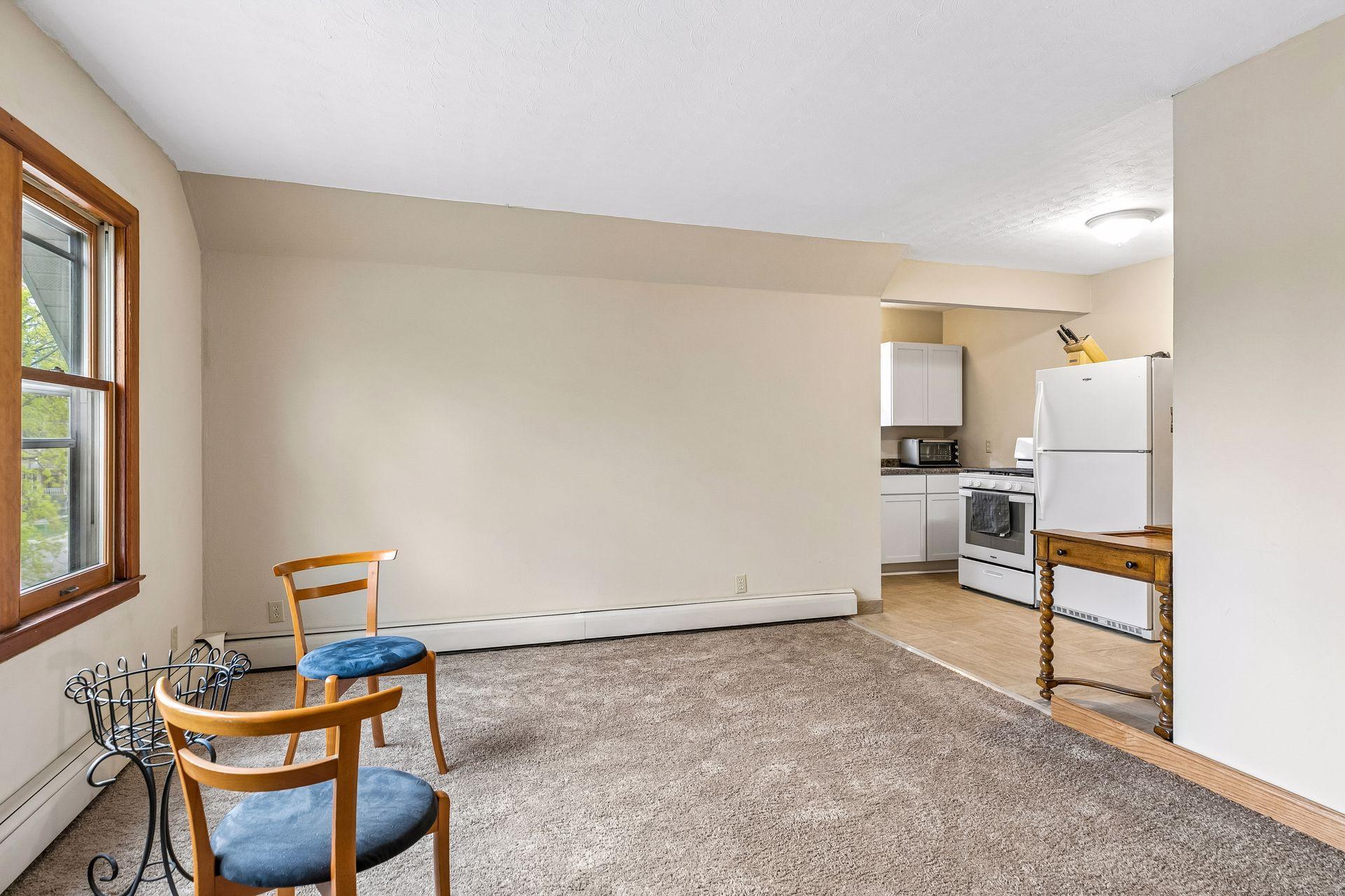 The upper-level unit features a comfortable living room with great natural light.