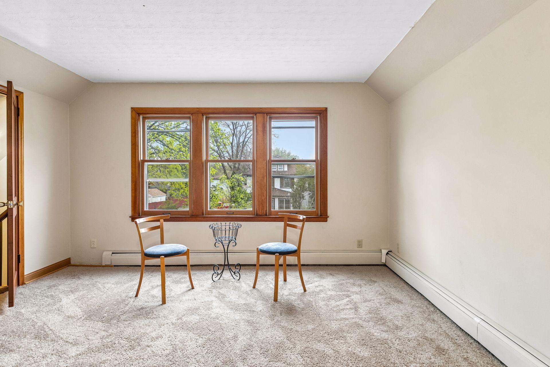 Another view of the upper-level living room highlights its cozy and inviting layout.