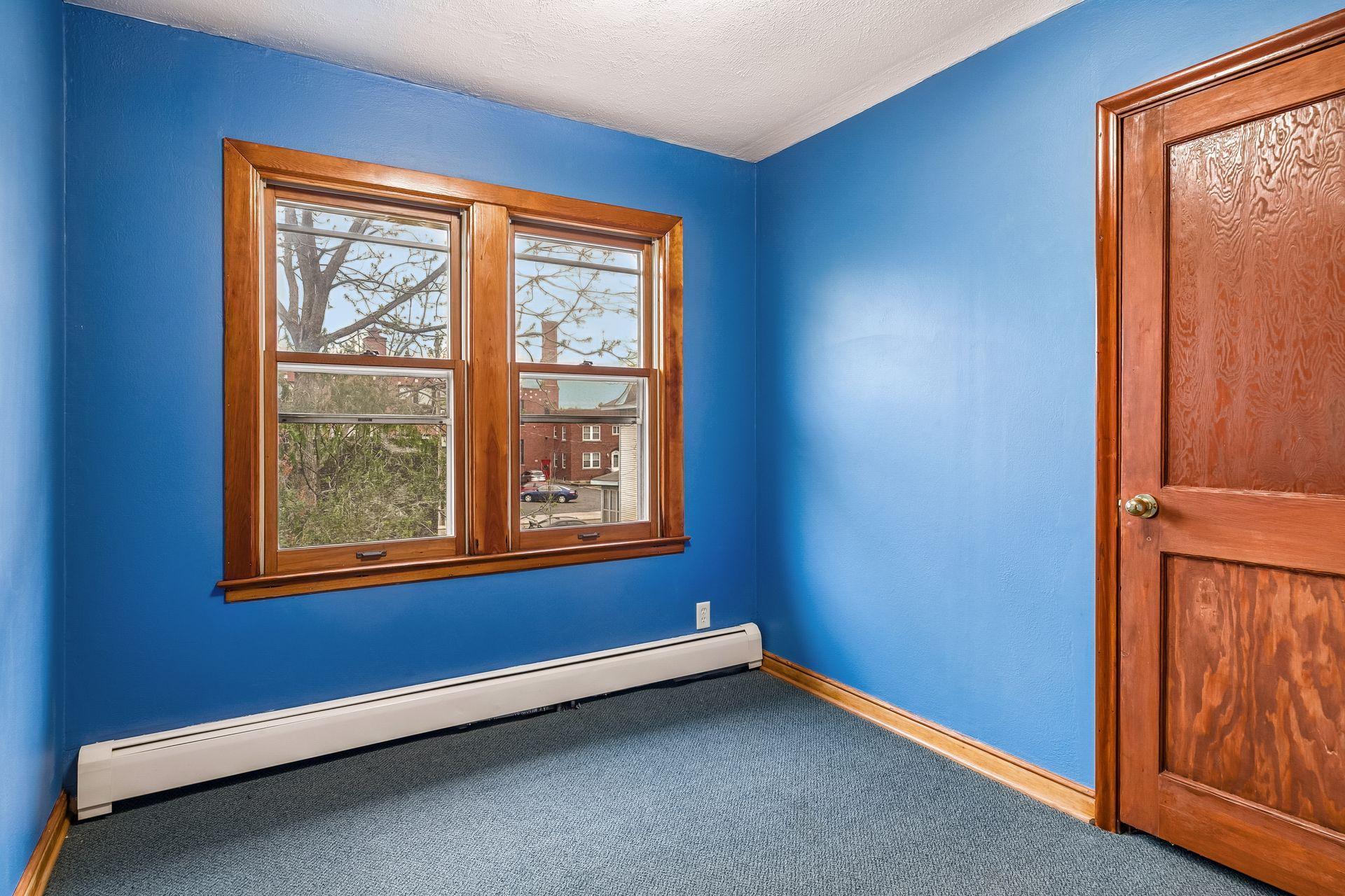 The second upper-level bedroom is spacious and versatile.