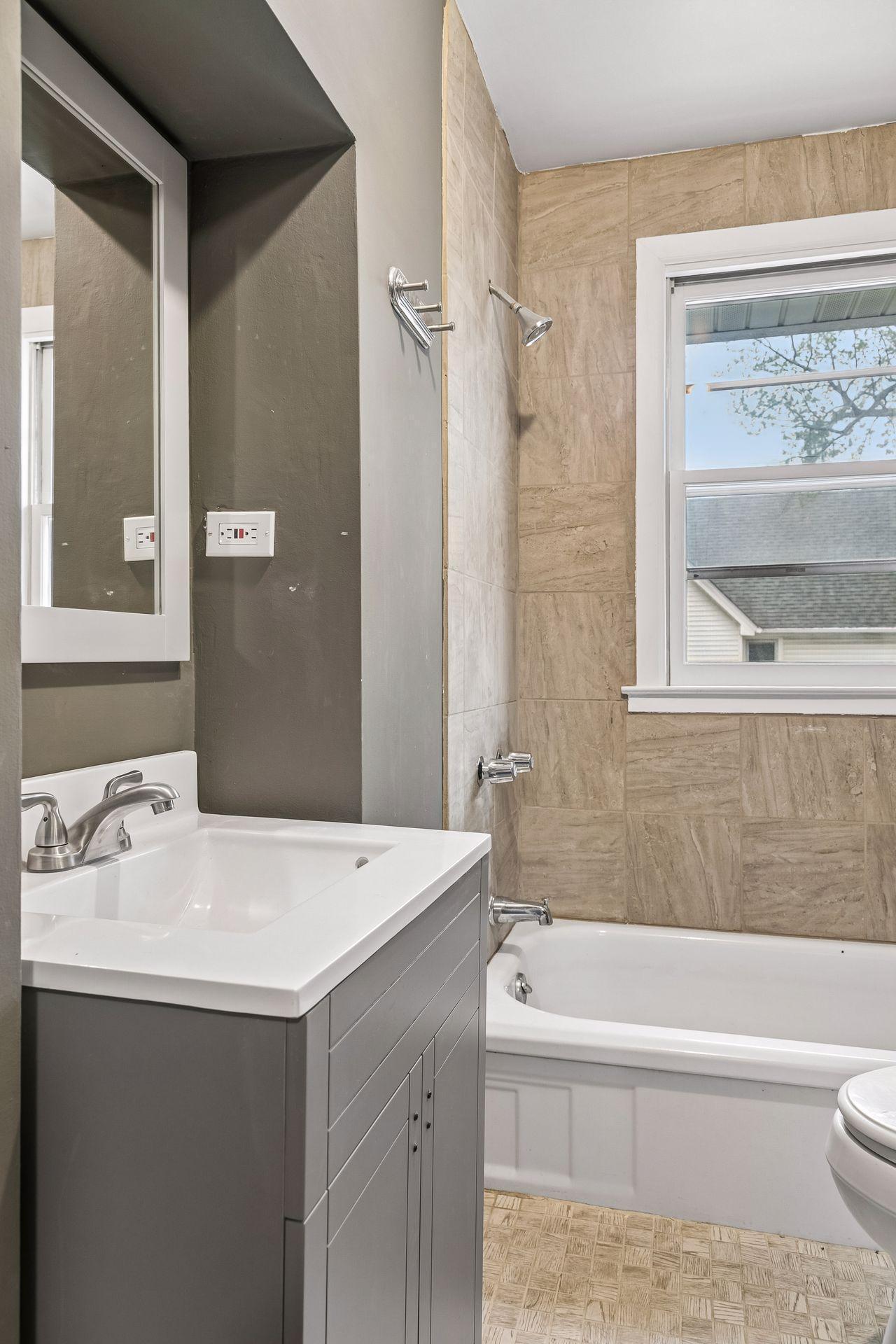 The upper-level bathroom is conveniently located and well-maintained.
