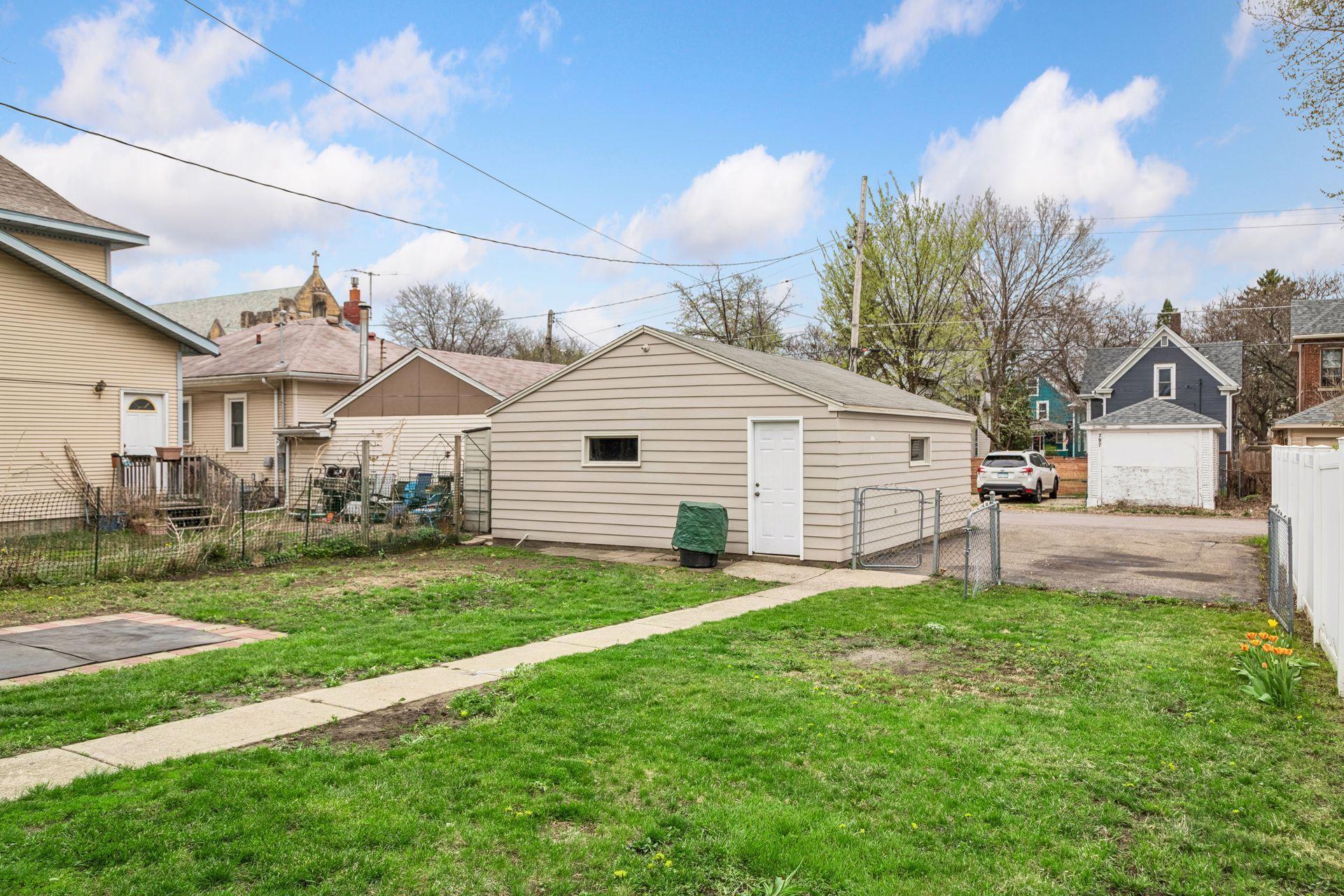 The property includes a two-car detached garage along with an additional parking pad.