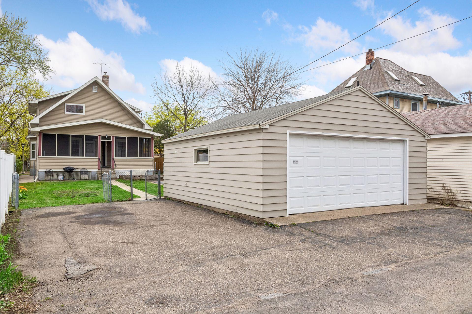 The garage and parking area provide ample space for vehicles, storage, or hobbies.