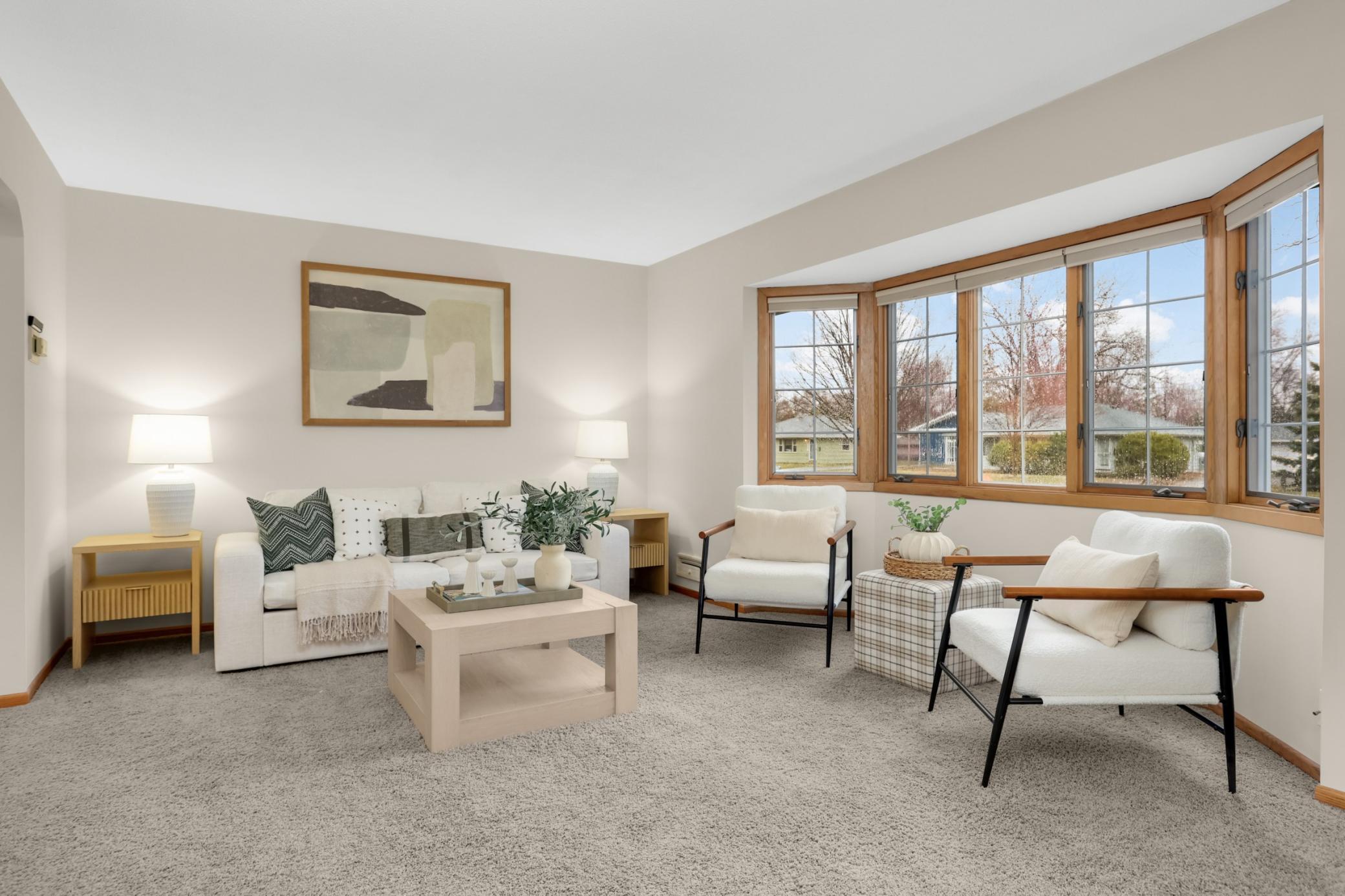 Natural light is pouring through the bay window