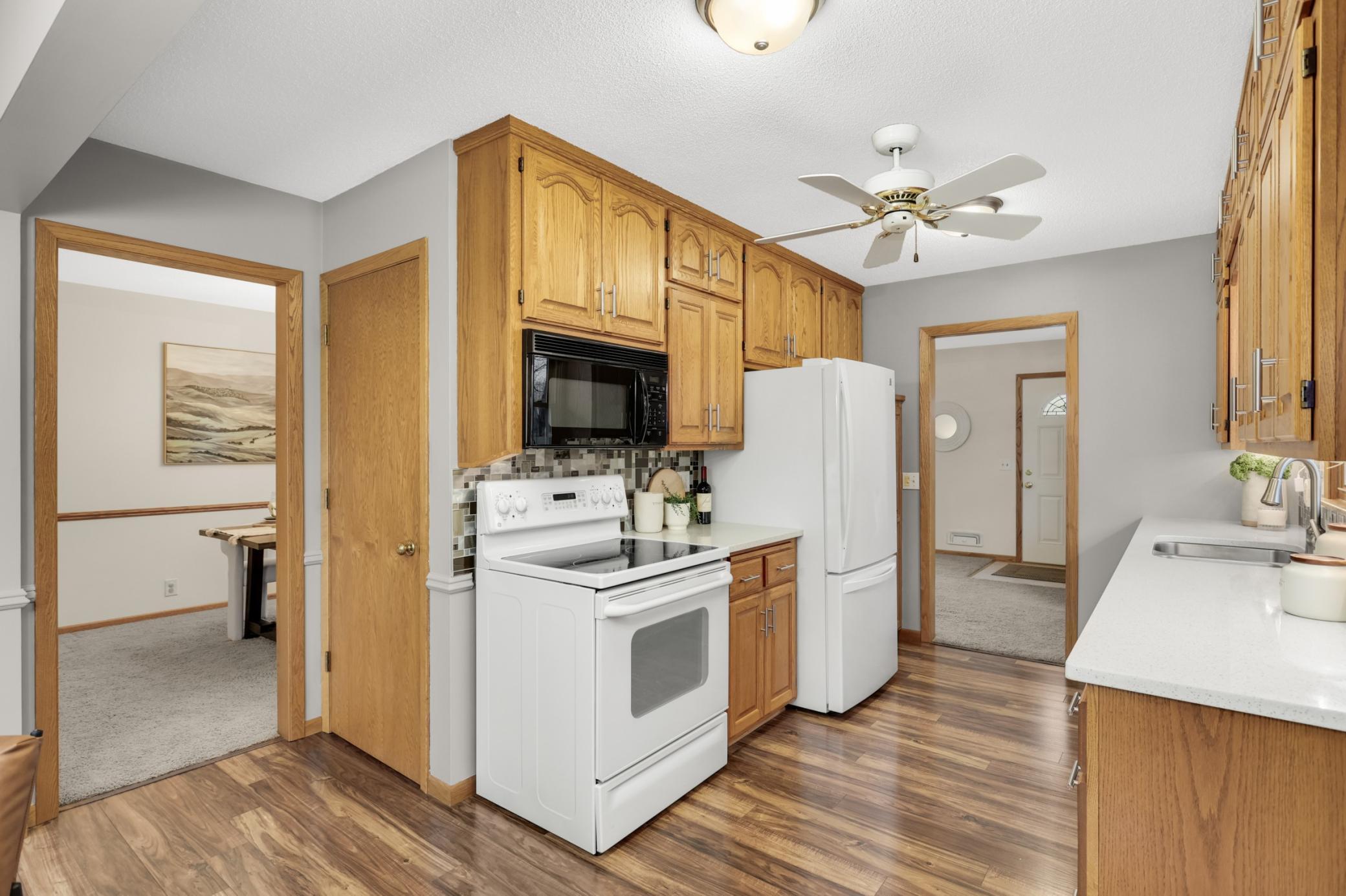 Modern kitchen with spacious fridge and stylish countertops.