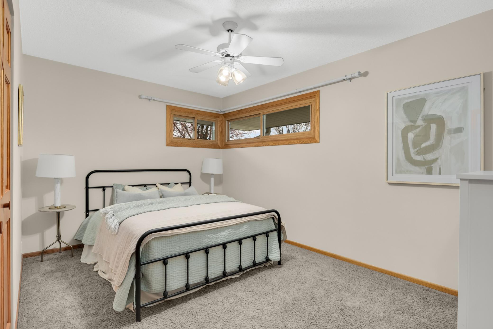 Cozy owner’s bedroom offering comfortable space, natural light, and a relaxing retreat feel